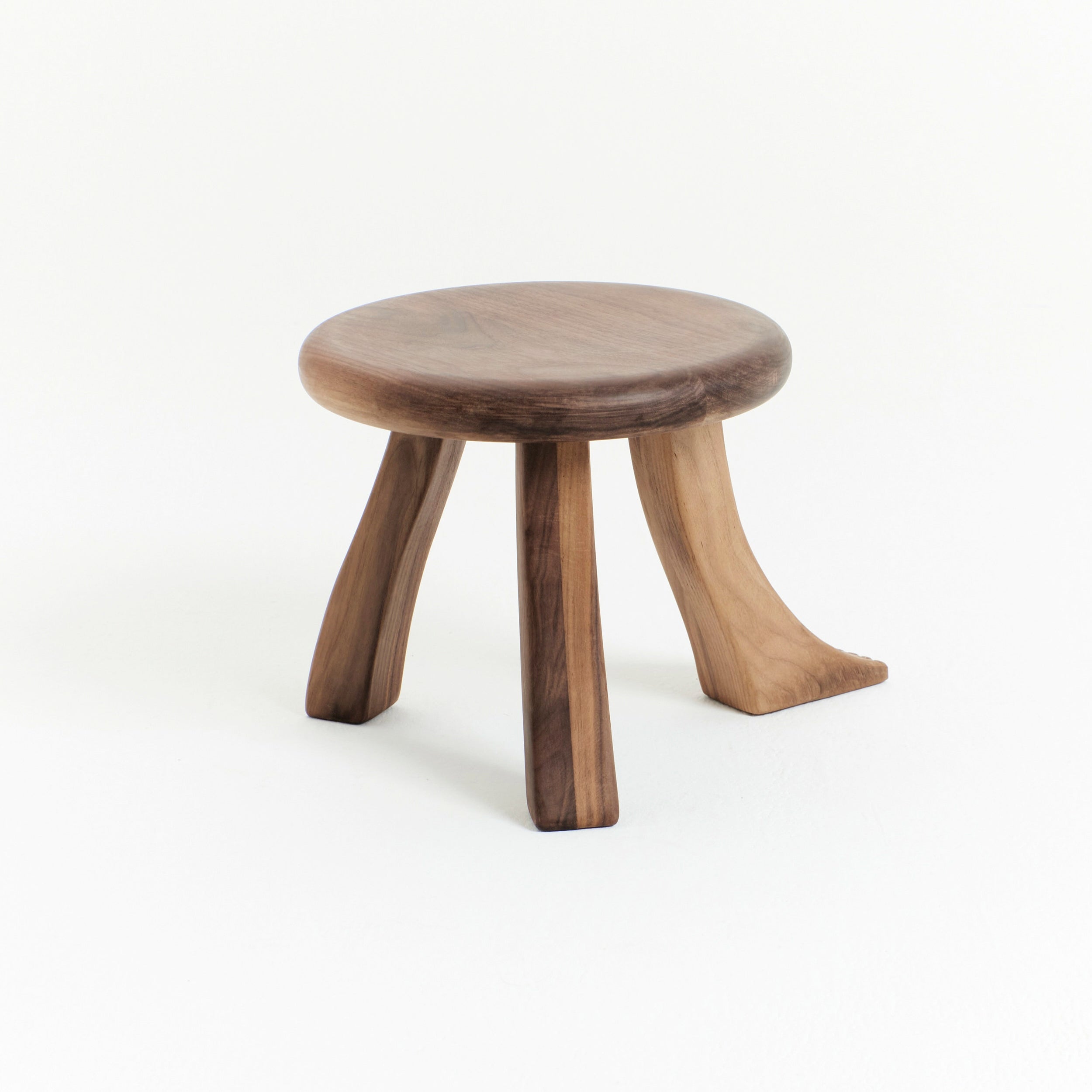Foot Stool in Black Chestnut — close-up of round wooden seat