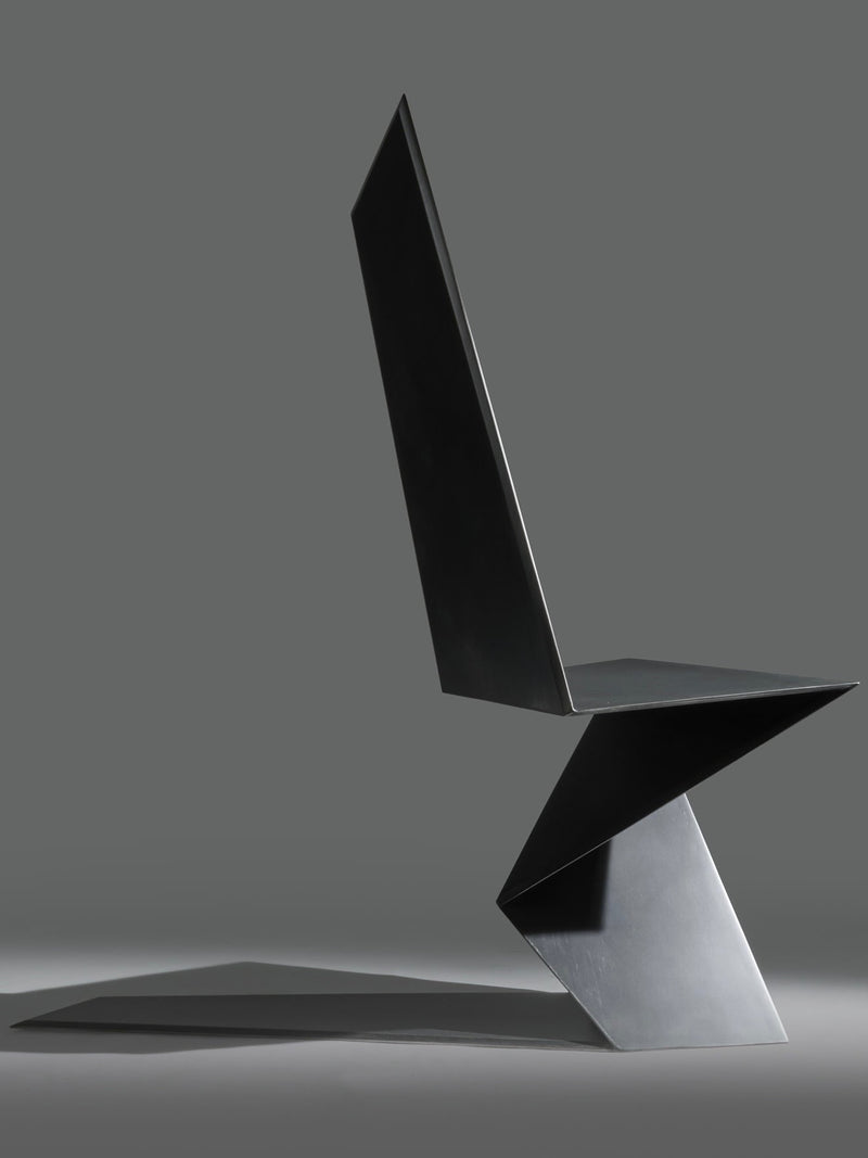DARK SIDE chair in metal, aluminum and black patina — side profile highlighting angular design