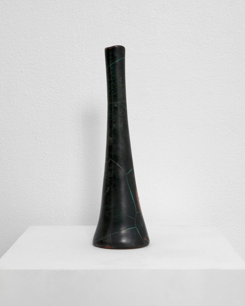 Tall dark green ceramic vase with natural marble veining detail
