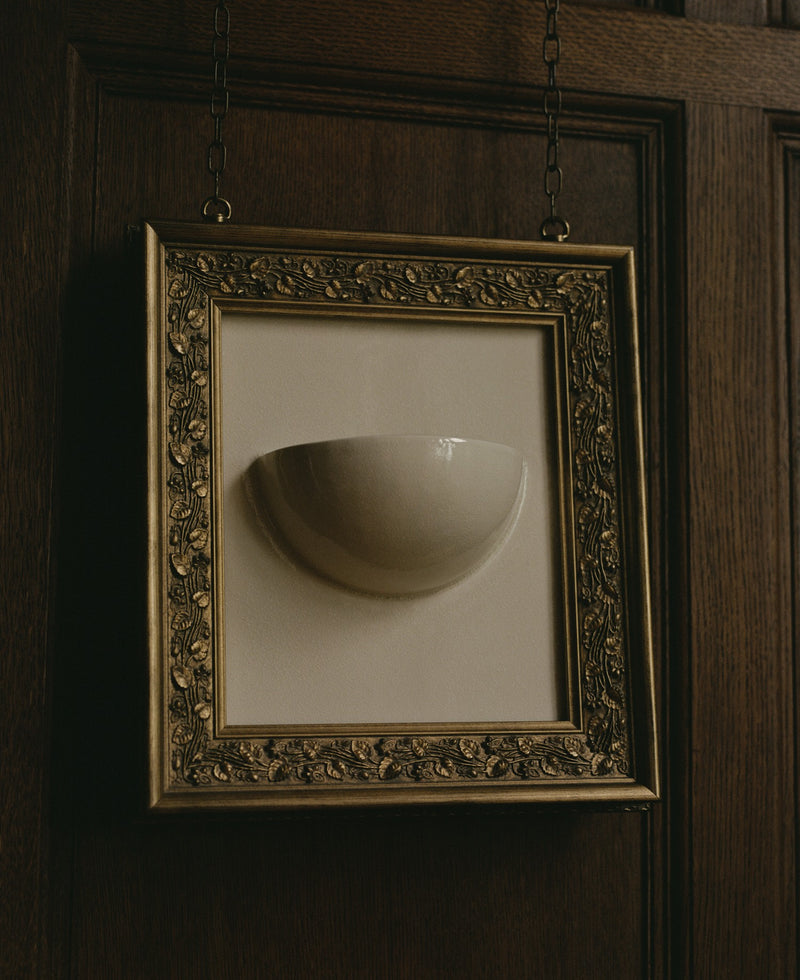Clea Sconce — close-up of white ceramic bowl in ornate frame