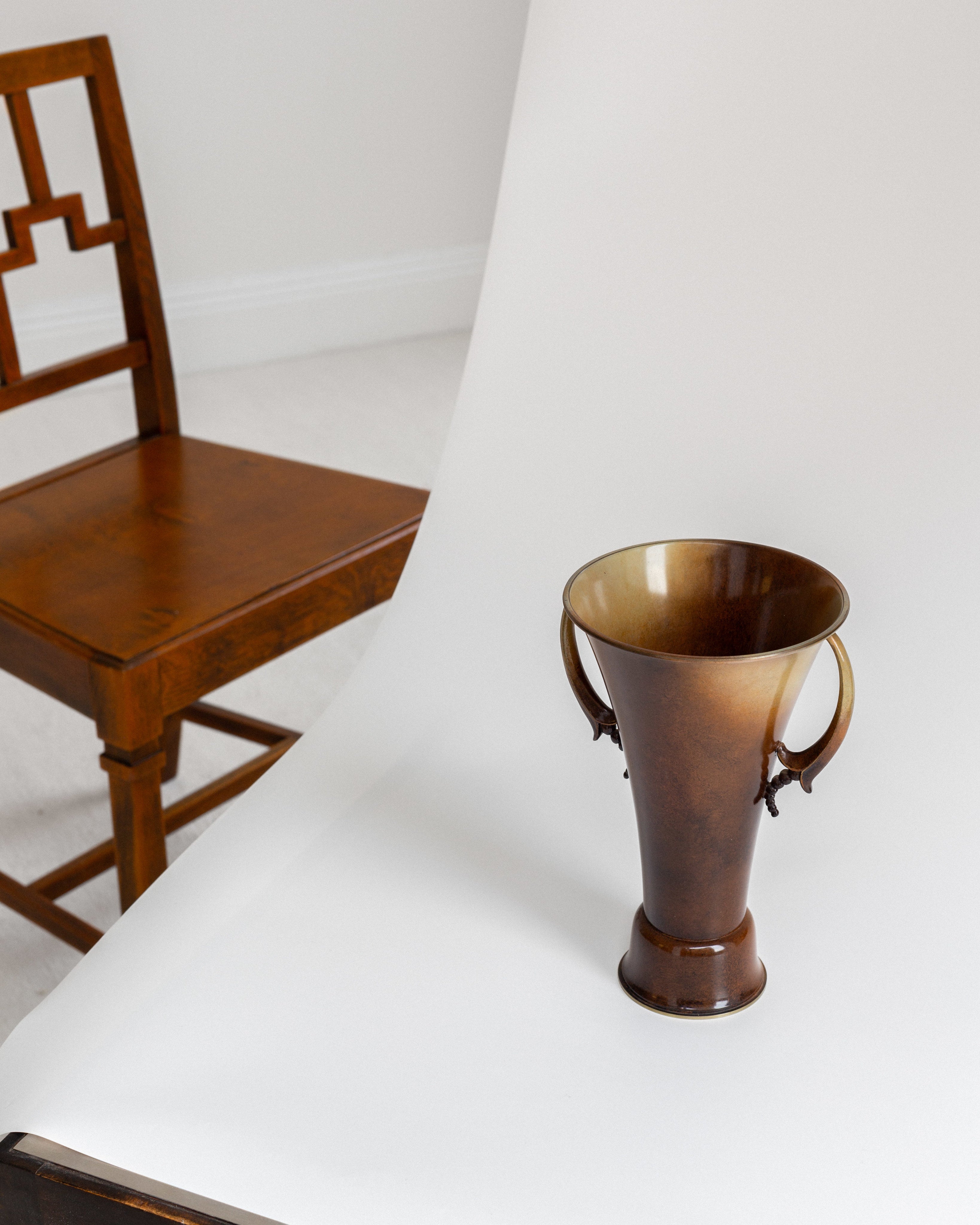 Neoclassic Bronze Patinated Vase by Ystad Metall — angled view on white backdrop