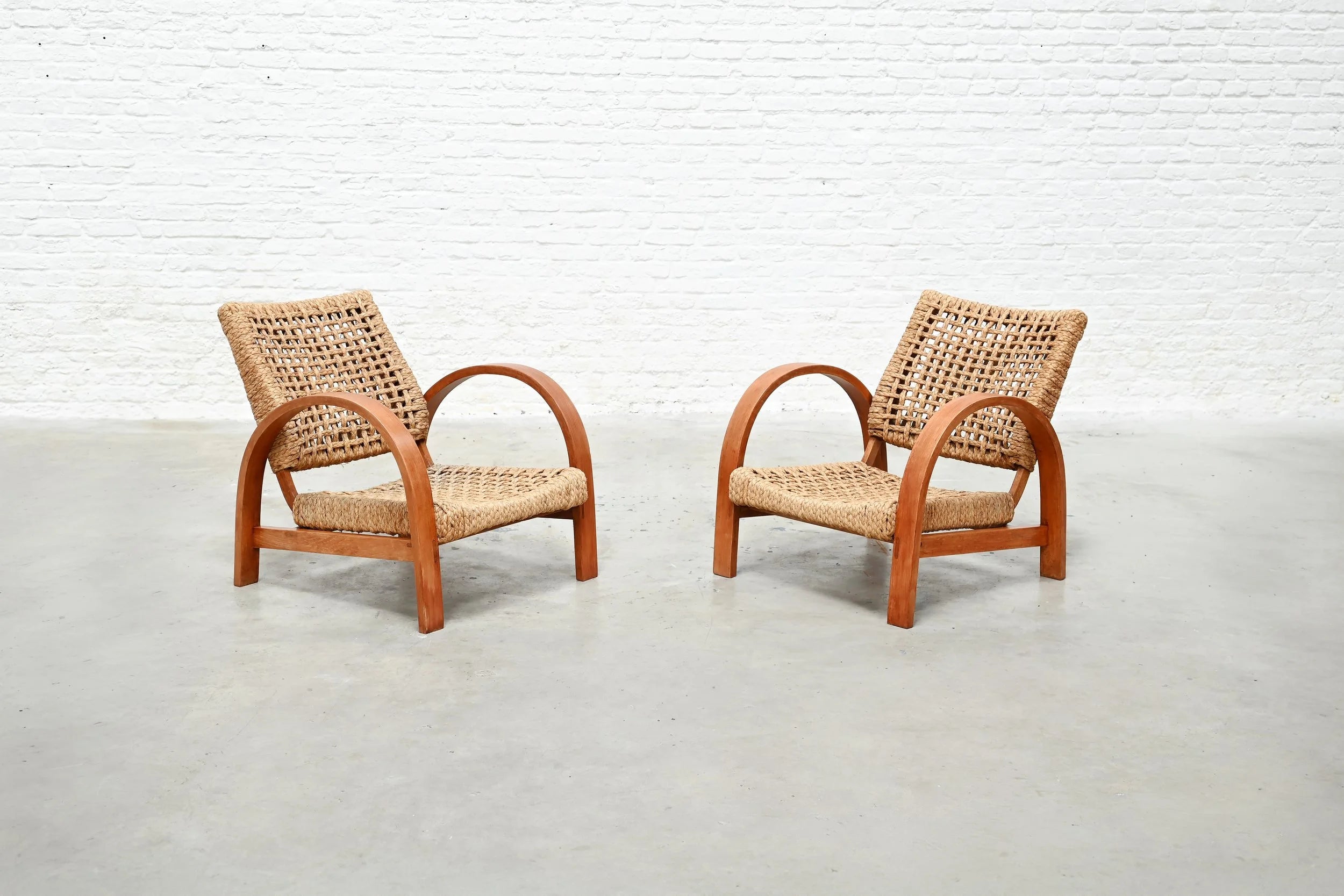 Pair of Rope Easy Chairs, France 1940's — angled view on concrete floor