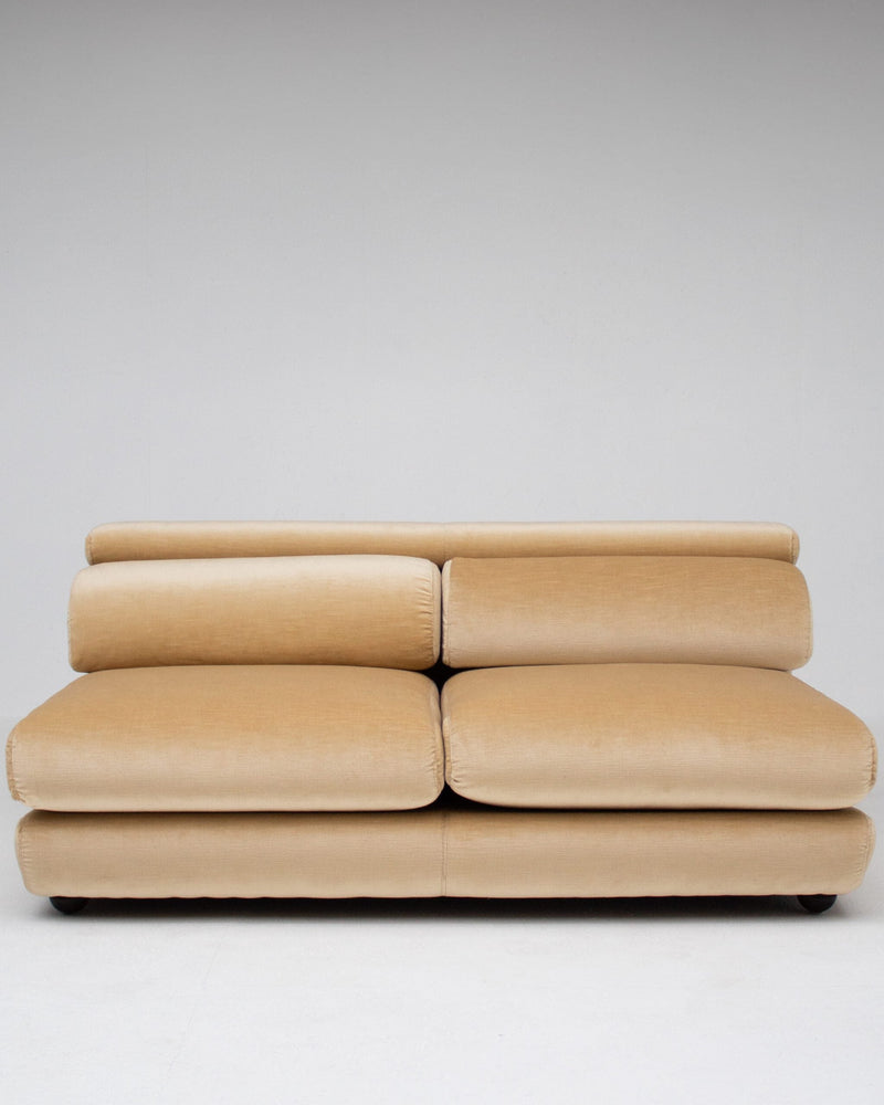 Sofa by Gigi Radice in beige velvet — front view highlighting plush cushions