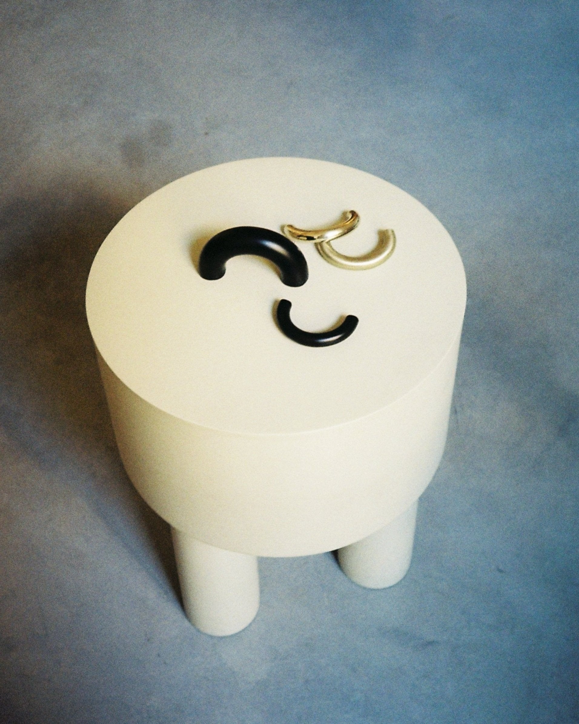 CERCLE Cabinet Pull Thin (2 sizes) — overhead view on round white table