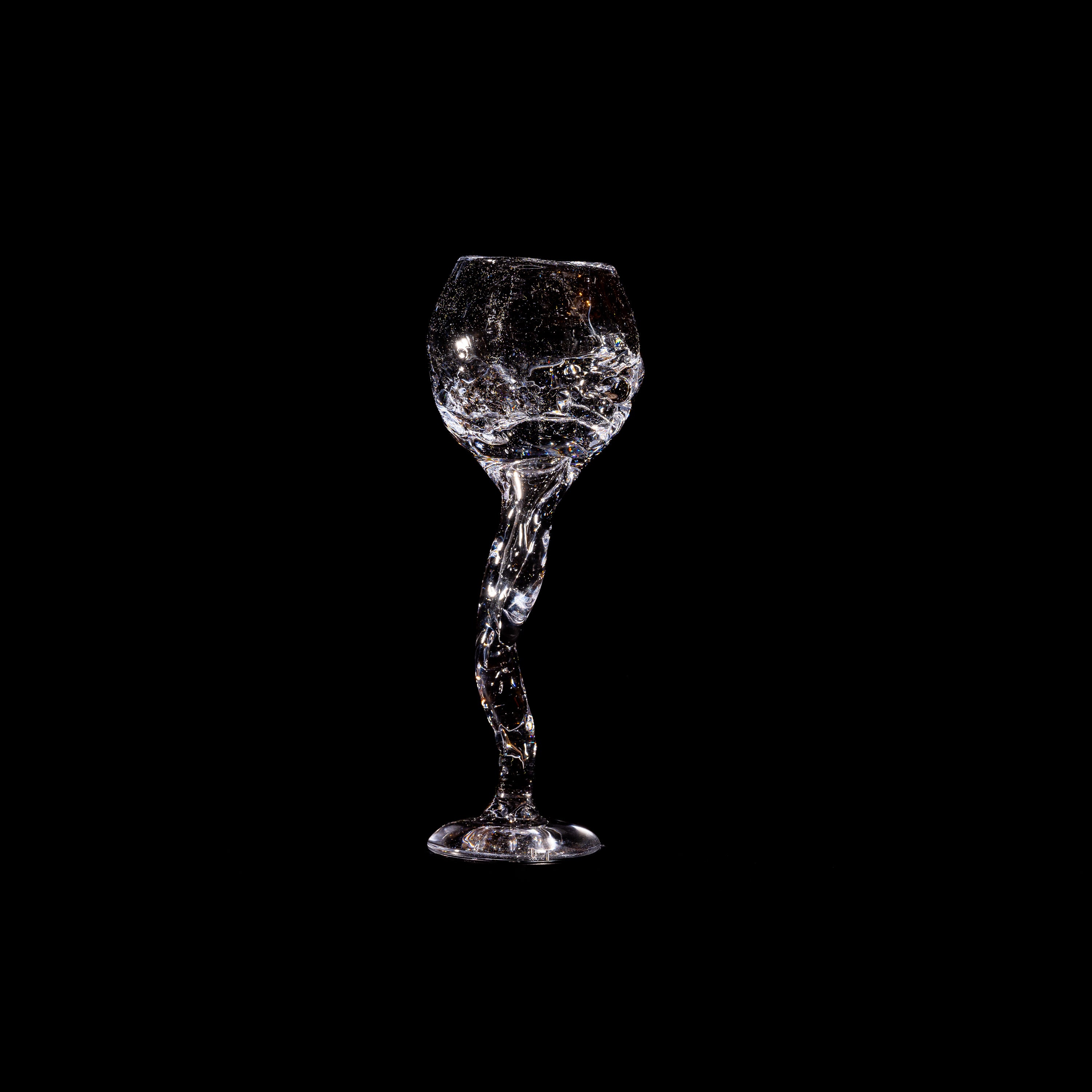 Hand-blown Wine Glass — clear glass with twisted stem on black background