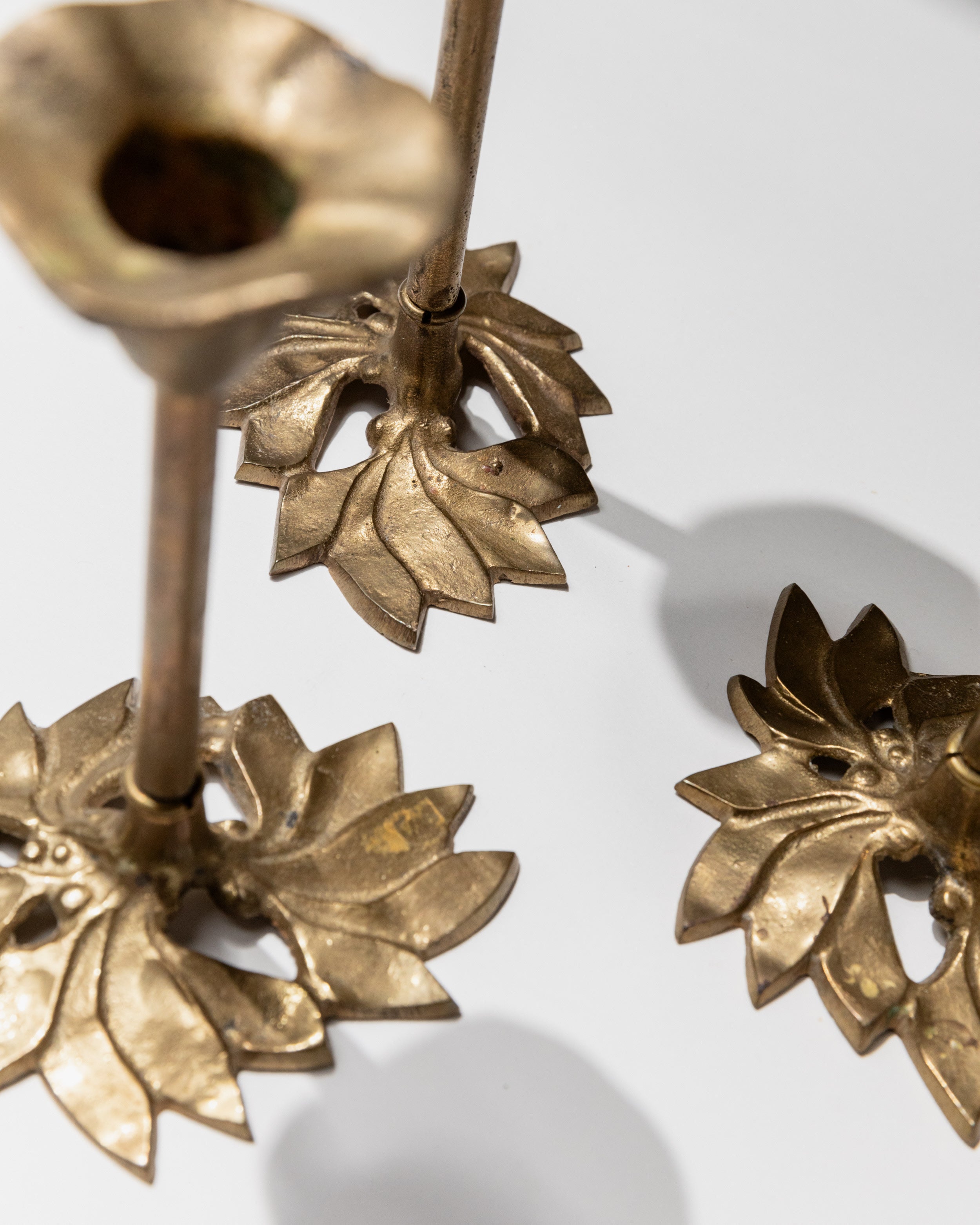 Ornate brass lotus flower candle holder details from 1940s Italian set