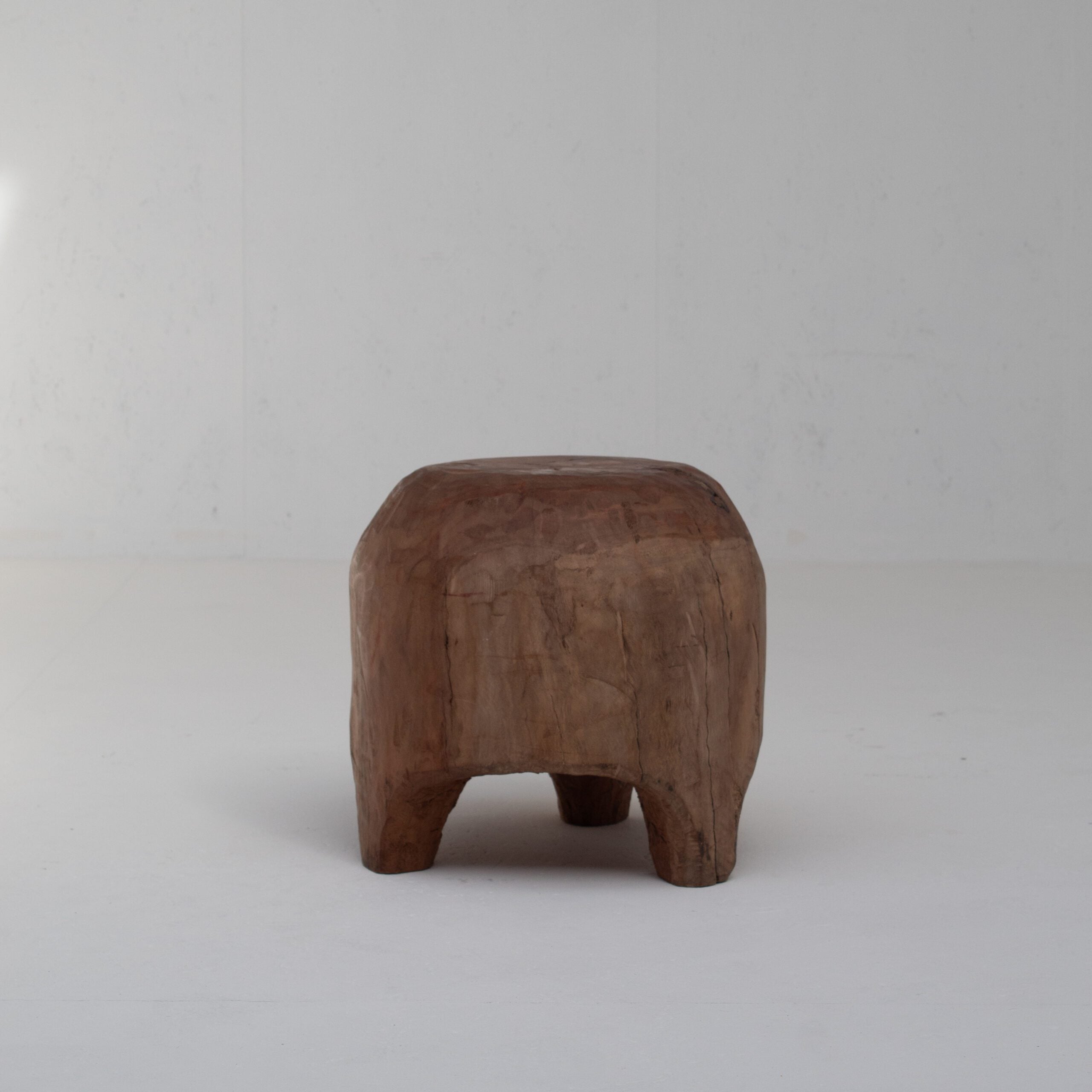 Sculptural Solid Wood Stool in Warm Natural Patina — lifestyle setting