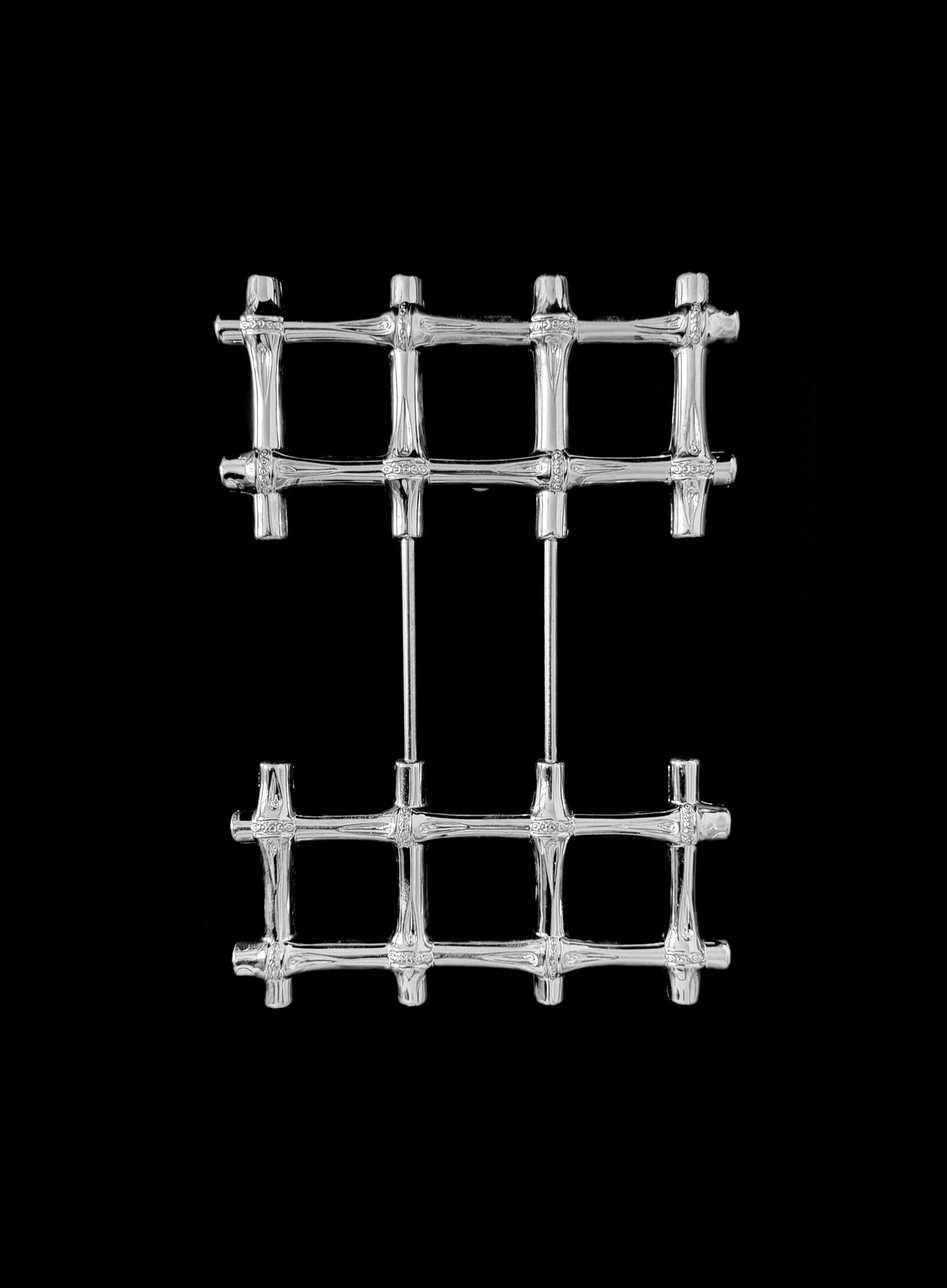 A vintage silver plated trivet — detail view