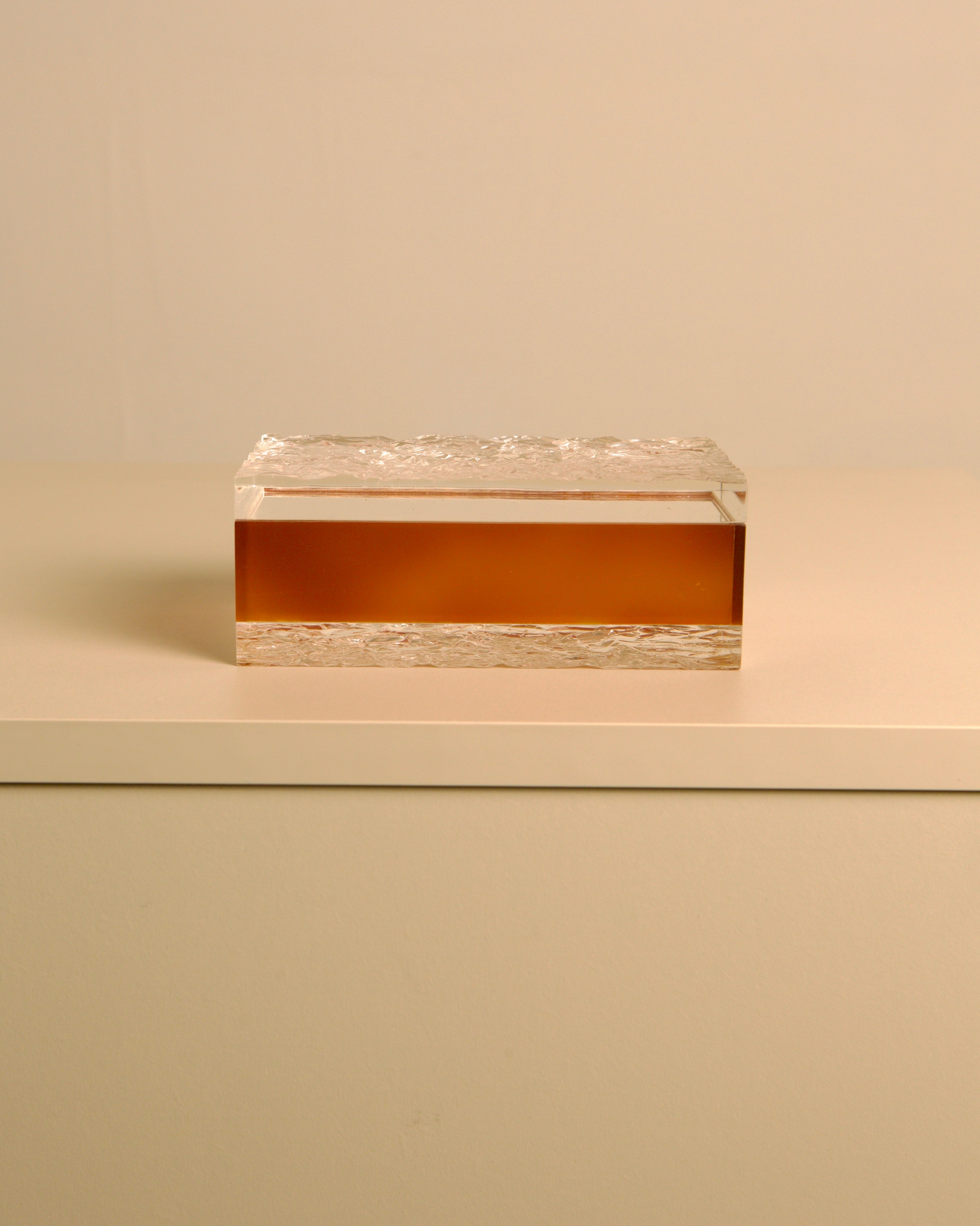 Italian Box in Smoked Plexiglass — close-up of textured surface on white table