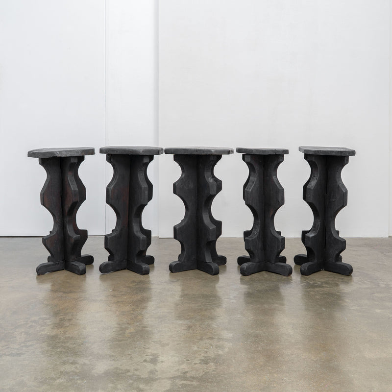 Sculptural Brutalist Bar Stools — side view of black sculptural legs