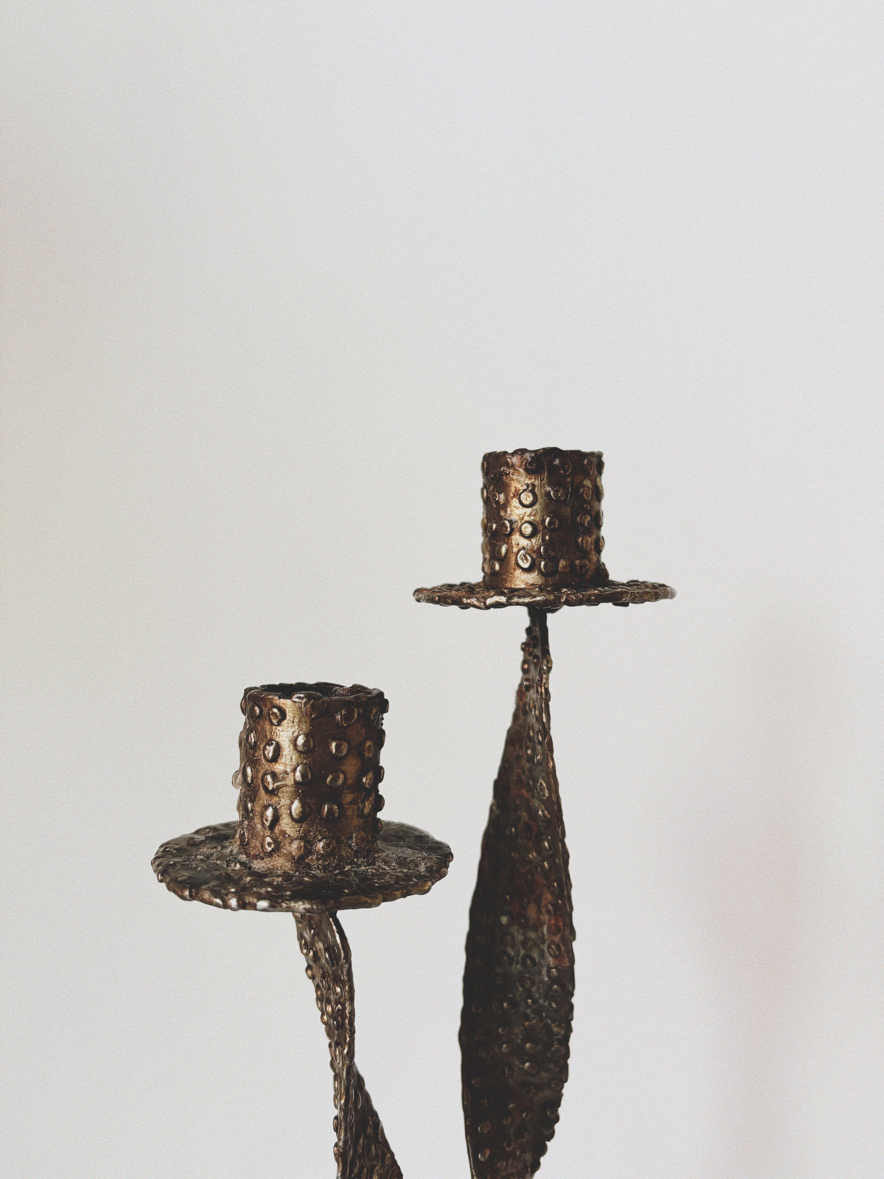 Textured Metal 2 Arm Candlestick, Poland — side angle highlighting hammered bronze finish