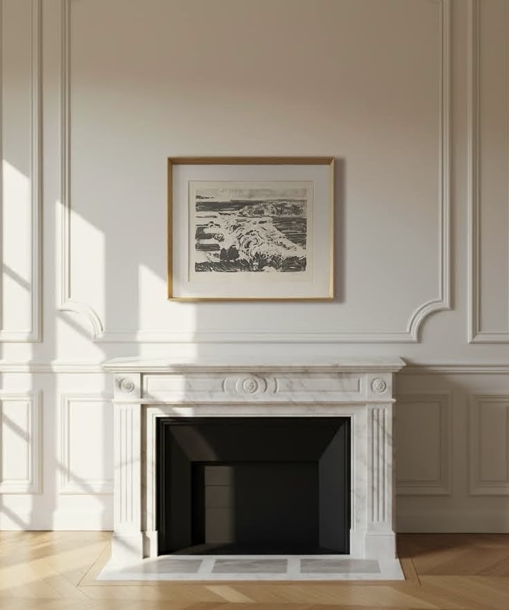 A white marble fireplace with classic detailing stands against an ornate, light-paneled wall. Above the mantel hangs the Large Midcentury Seascape by Médecine. Sunlight casts soft shadows across the scene.
