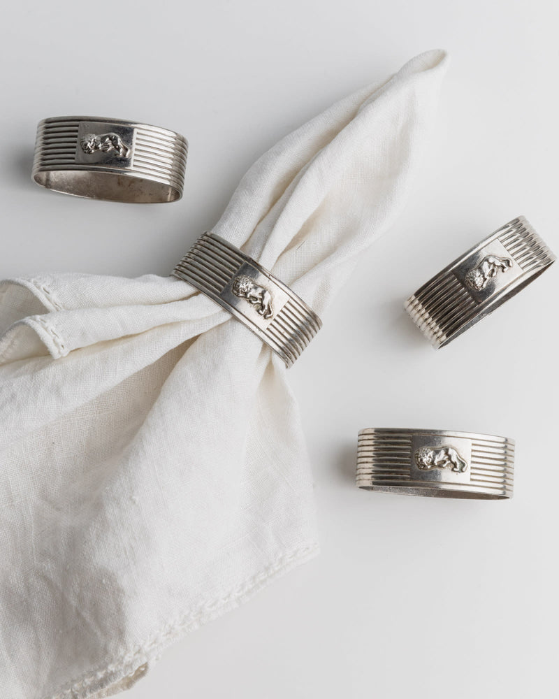Vintage 1960s Silver Plated Napkin Rings, Set of 4, Ribbed Design with Lion Motif, Classic — close-up of napkin rings on line