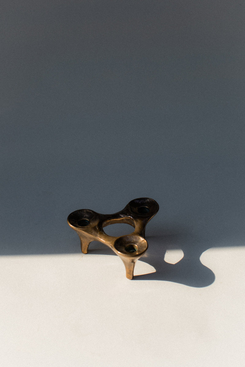 Modern bronze candleholder with three organic curved holders