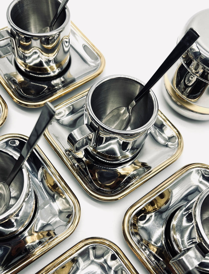 Polished stainless steel Italian coffee cups with saucers and spoons