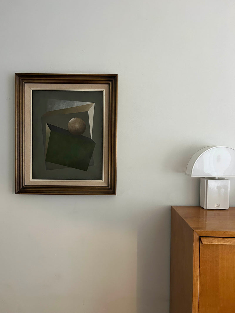 Green Gravity — framed painting on wall above wooden cabinet