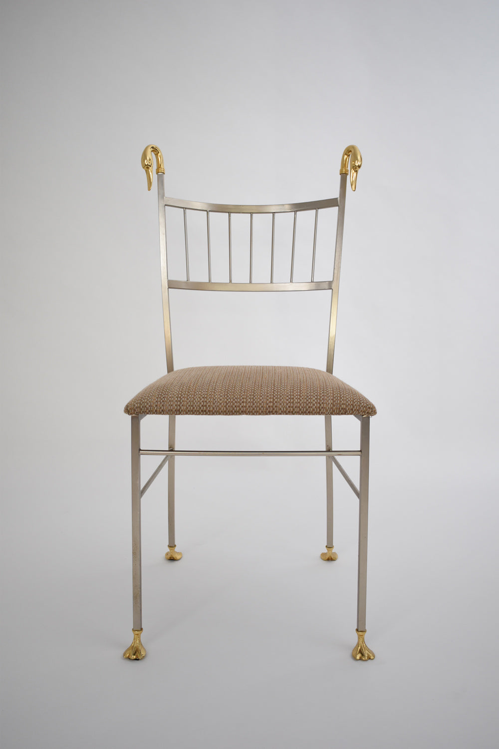 Pair of Swan Chairs — front view with gold accents and fabric seat