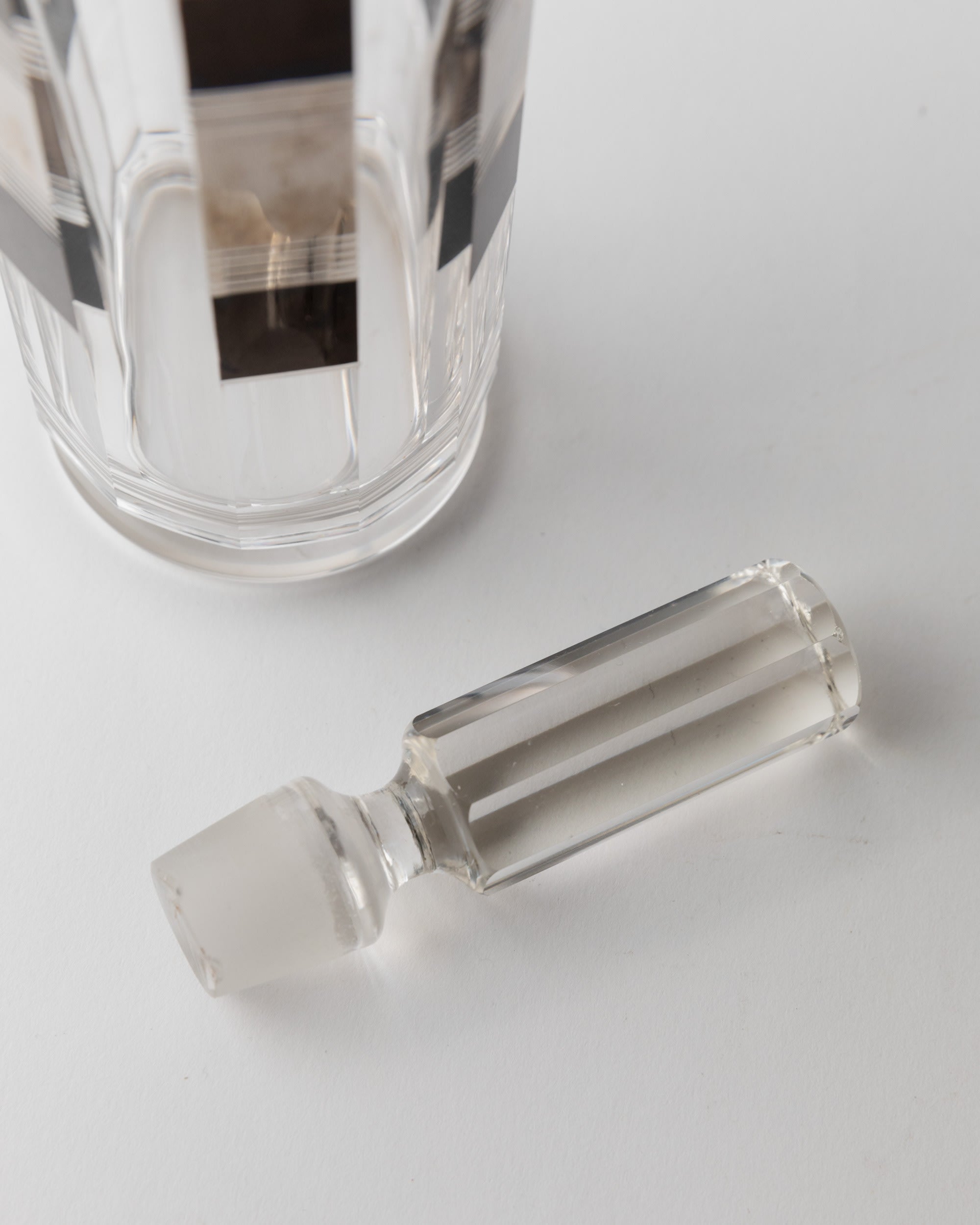 Liqueur Set Art Deco by Karl Palda 1930s — back view of glass stopper on white surface