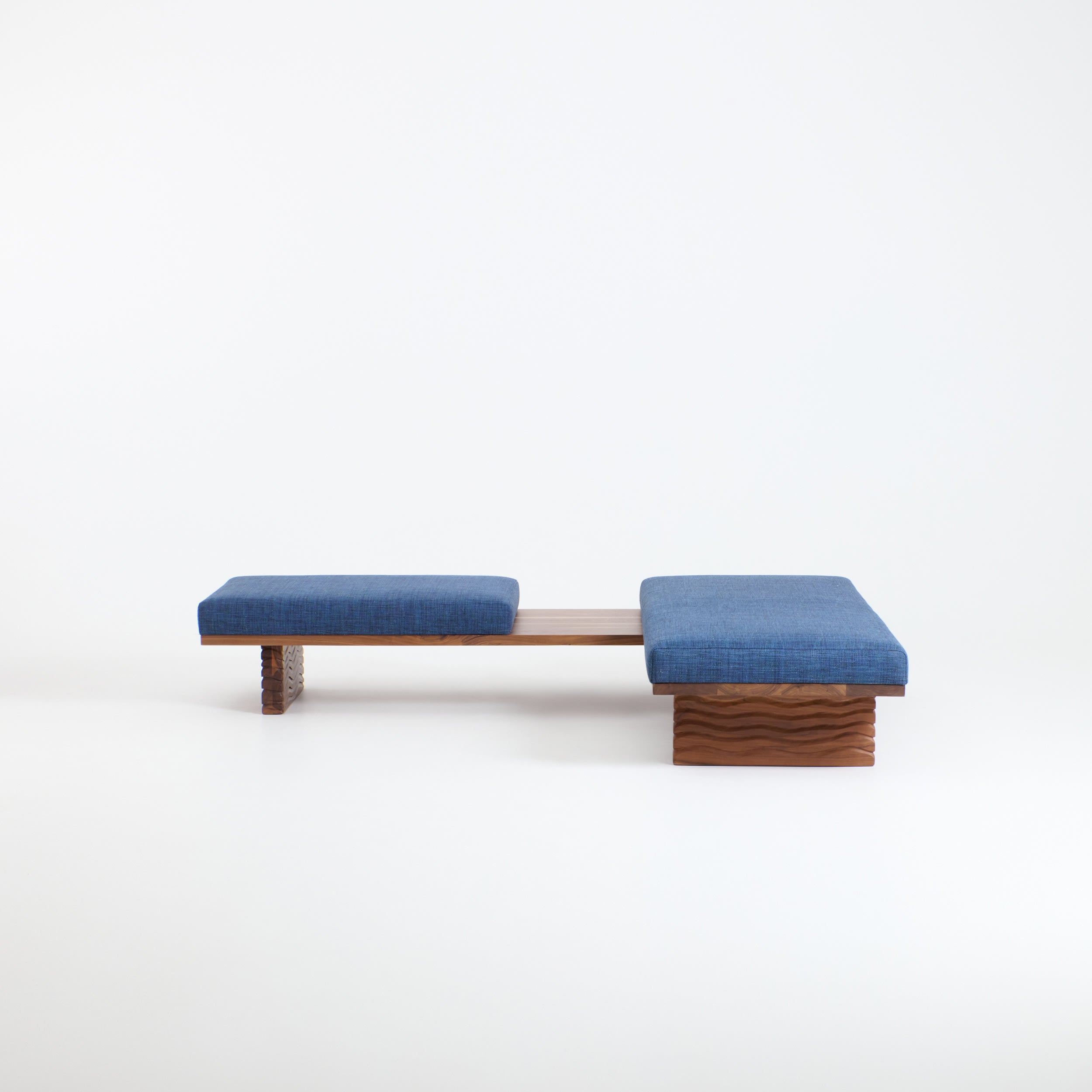 Nazaré Daybed L Shape — angled view with blue fabric cushions