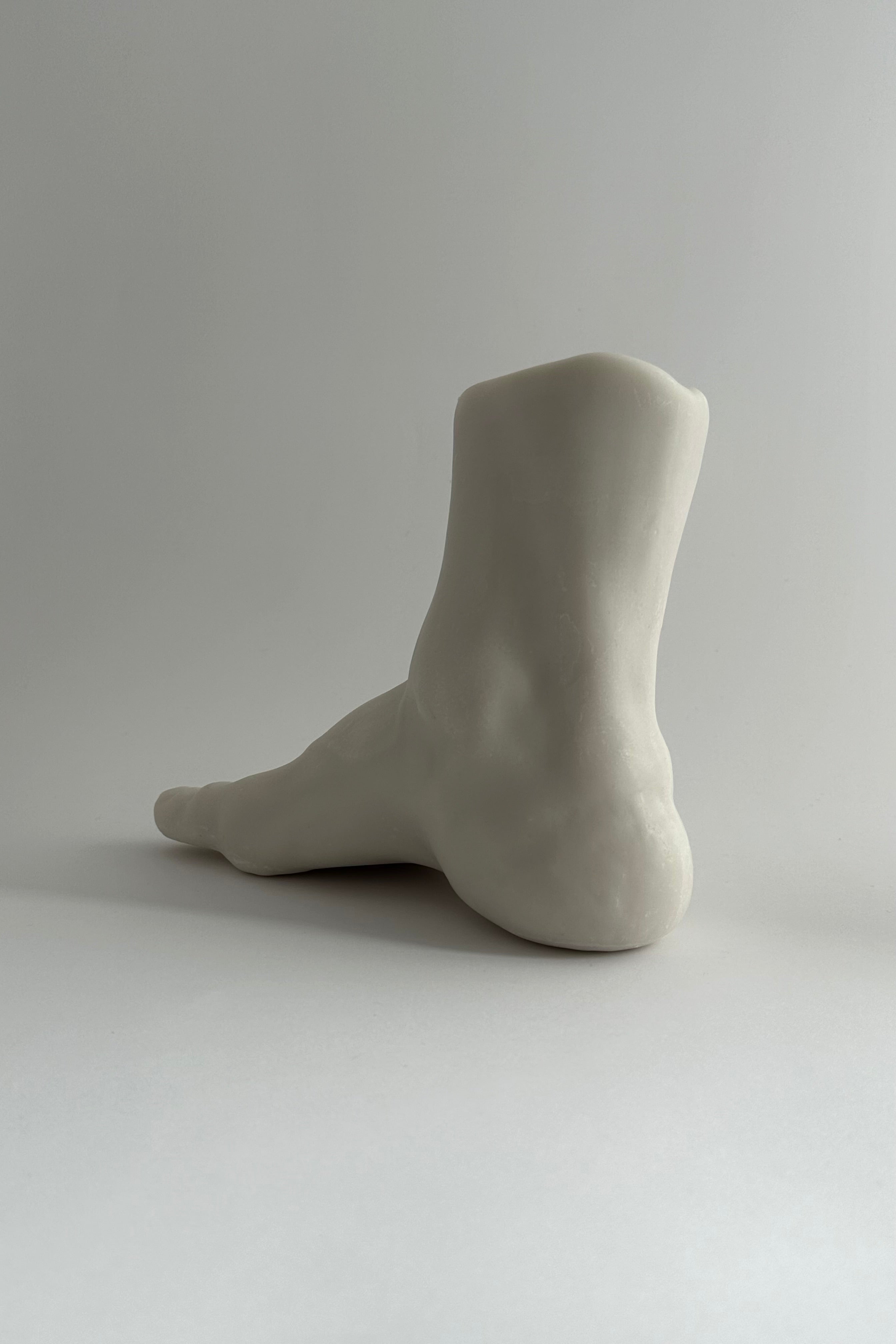 'TITAN' candle — close-up