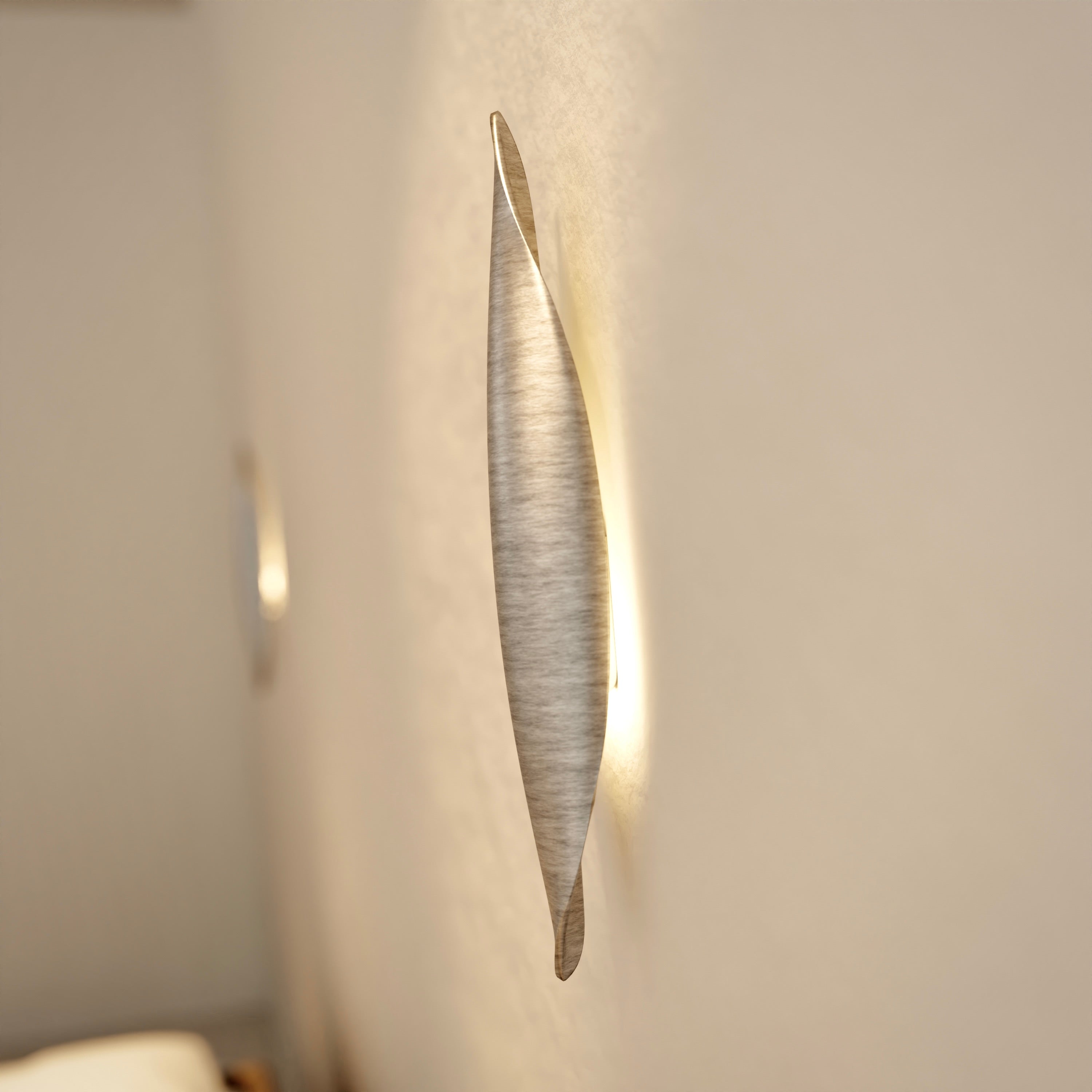 Plume Applique | Aluminum — side angle against a light wall