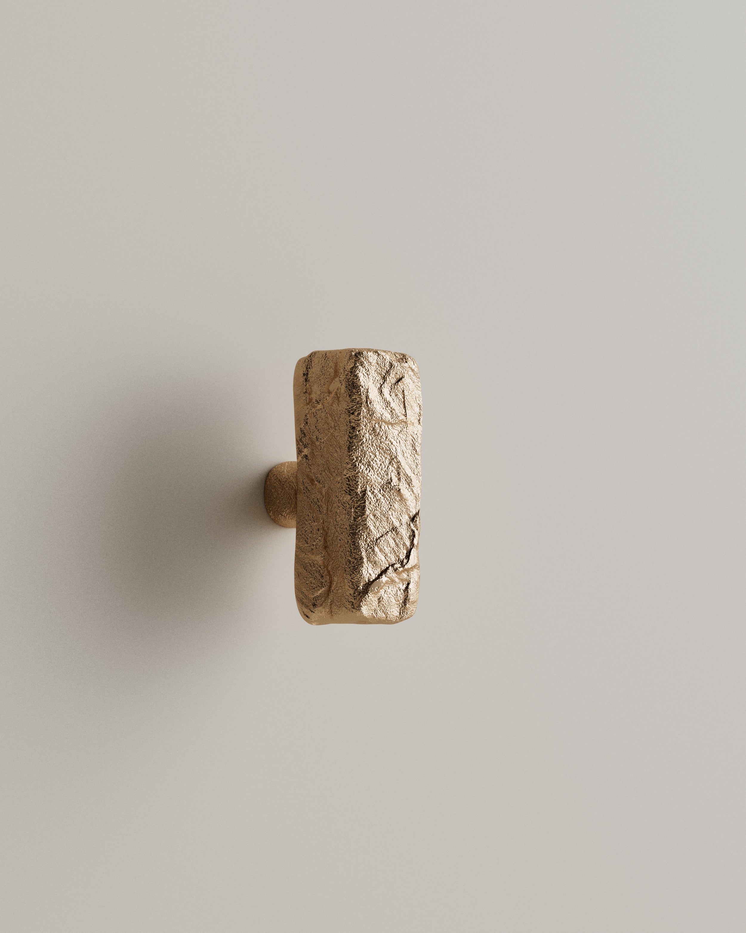 ISLE Cabinet Knob/Wall Hook Medium — top view of textured brass surface