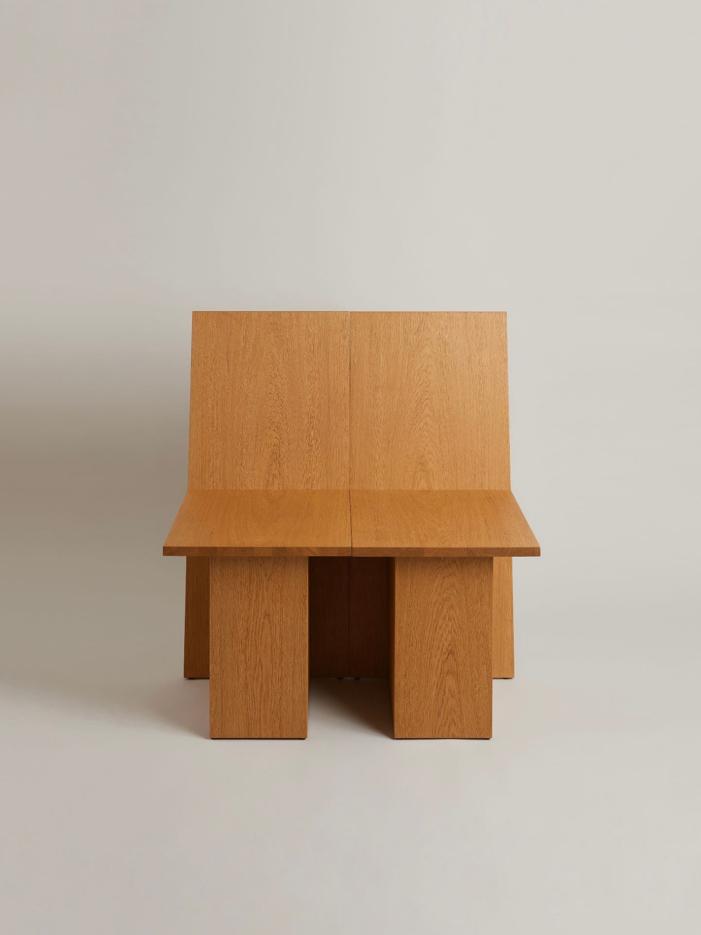 La Coupe" Modular Chair — side angle showing warm oak finish
