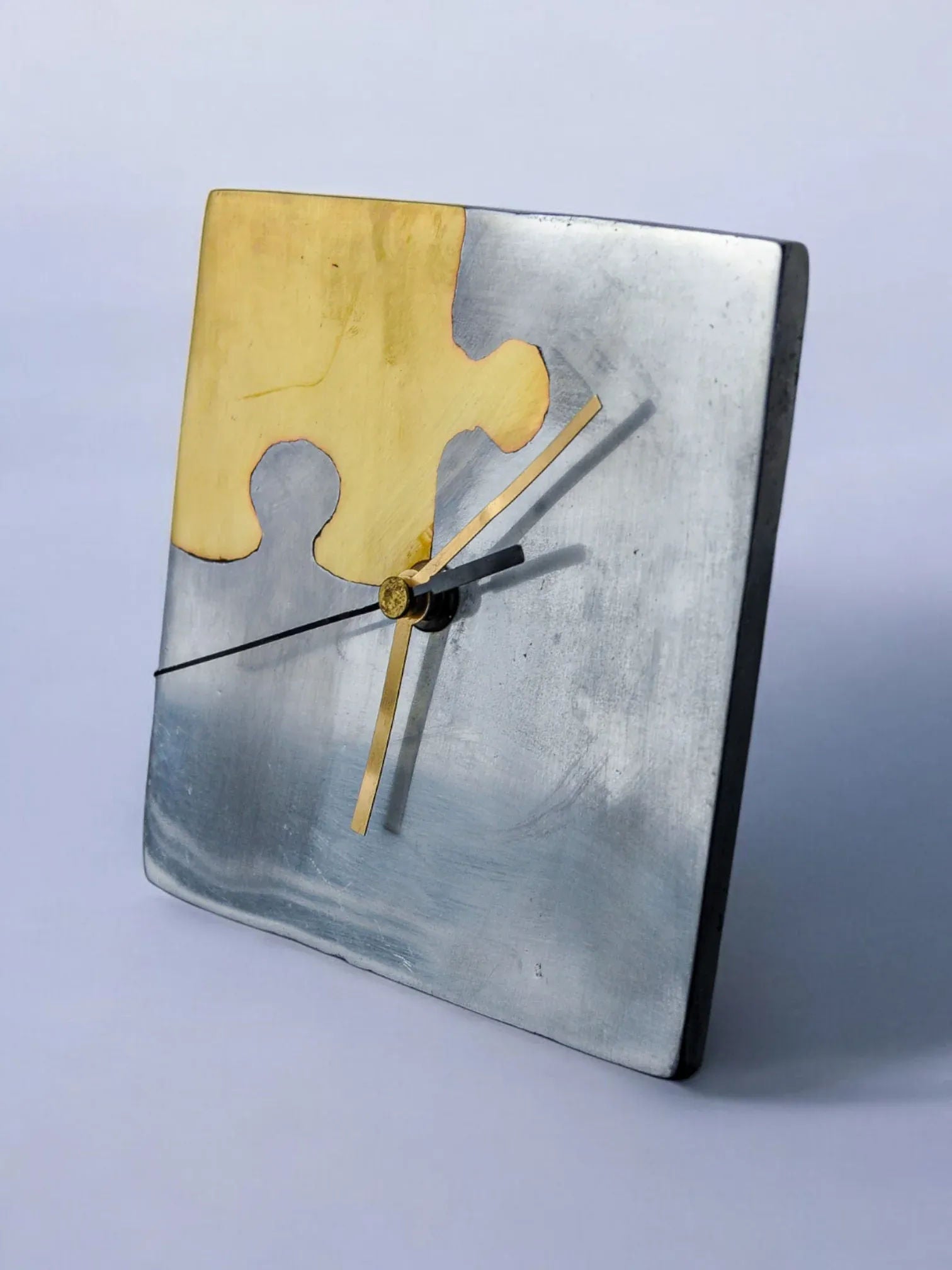 Brutalist Clock "Puzzle" by Art3, Spain, 1980 — side angle showing metal finish and puzzle piece