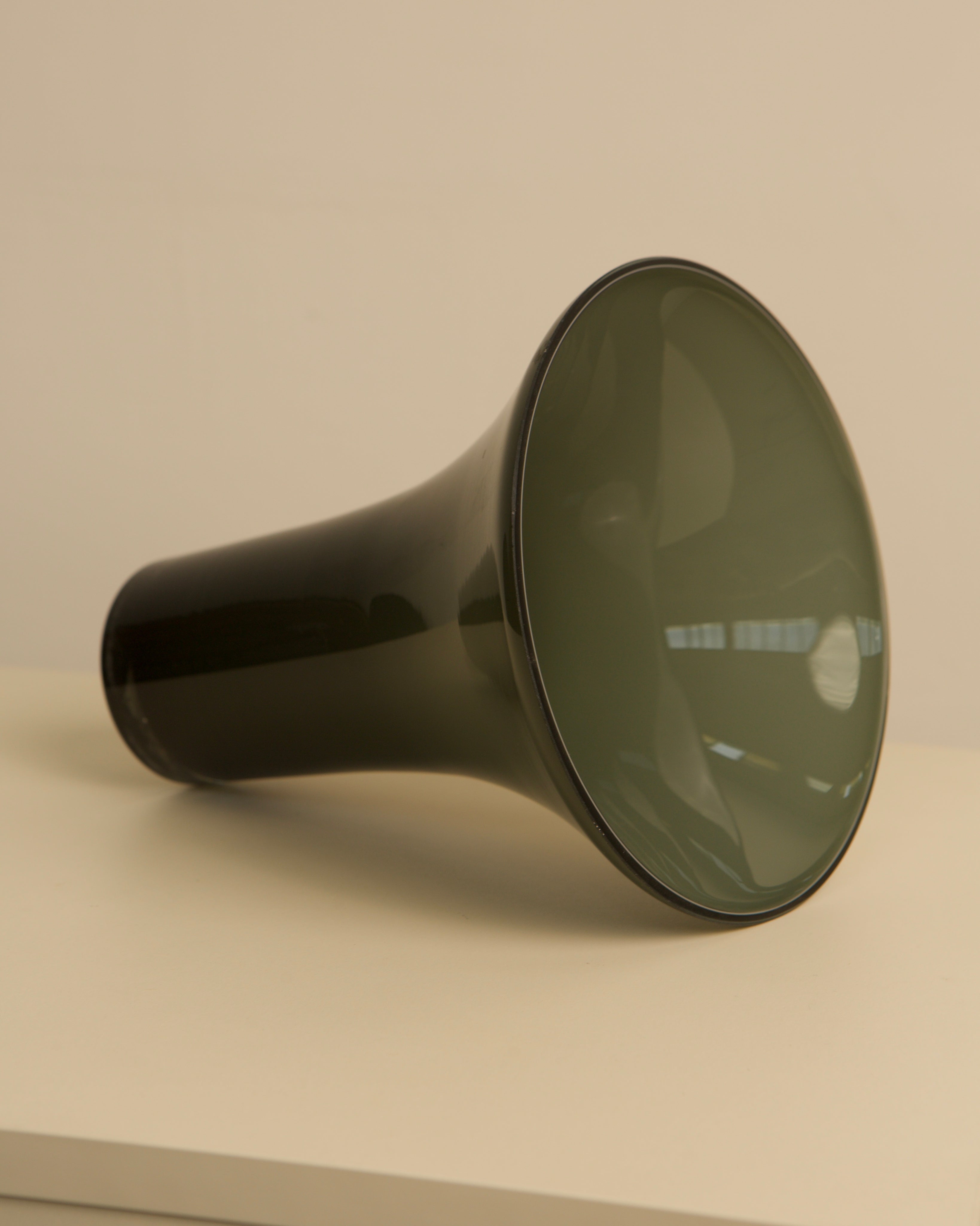 Elegant black Murano glass vase showing curved silhouette detail