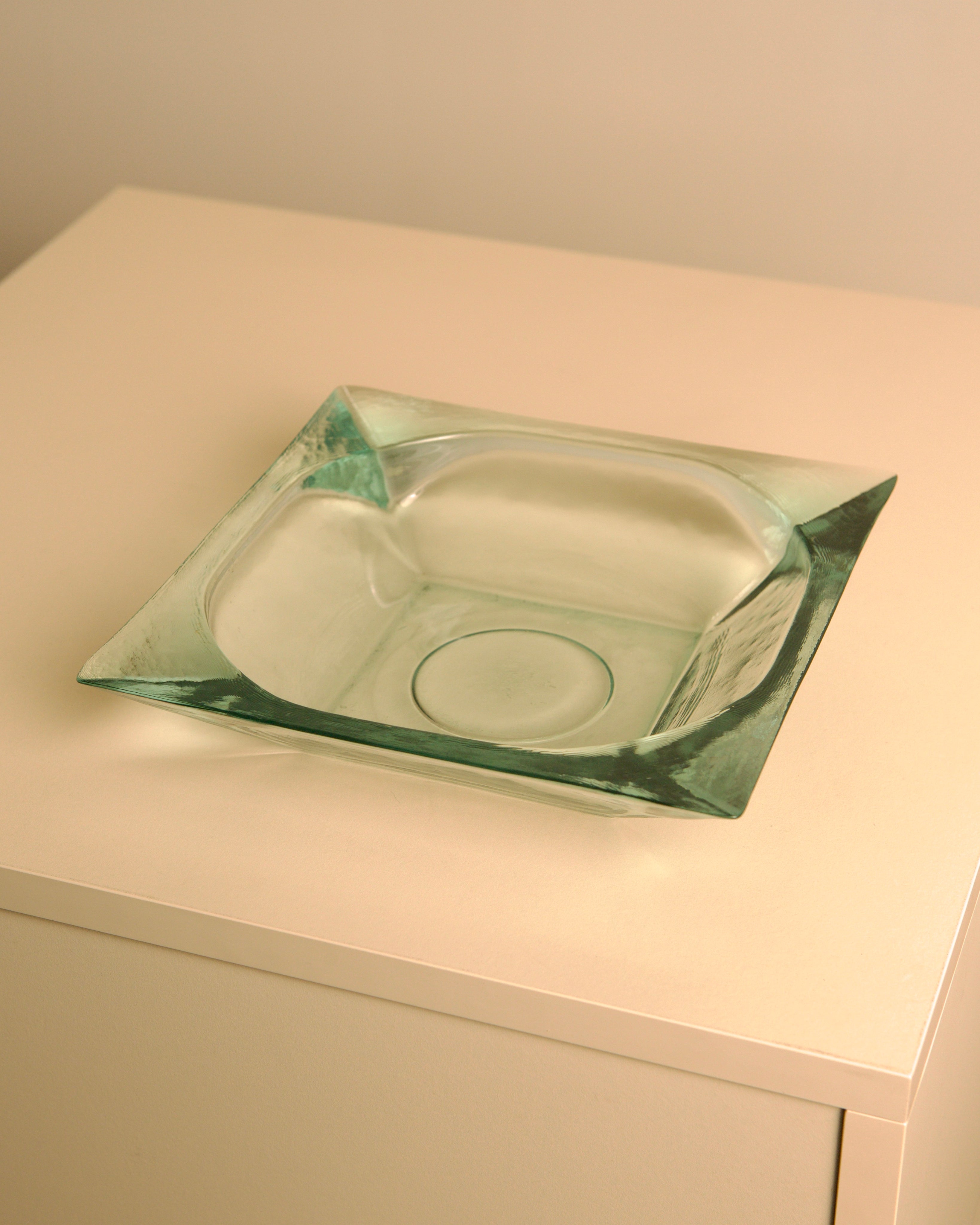 Large Italian glass basket by Fontana Arte — close-up showing transparent green glass surface
