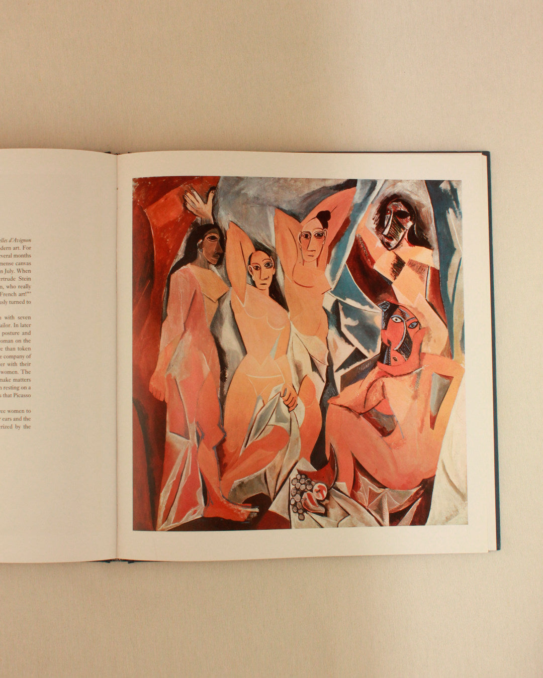 PICASSO 'THE MASTERWORKS' — side angle of open book on beige fabric