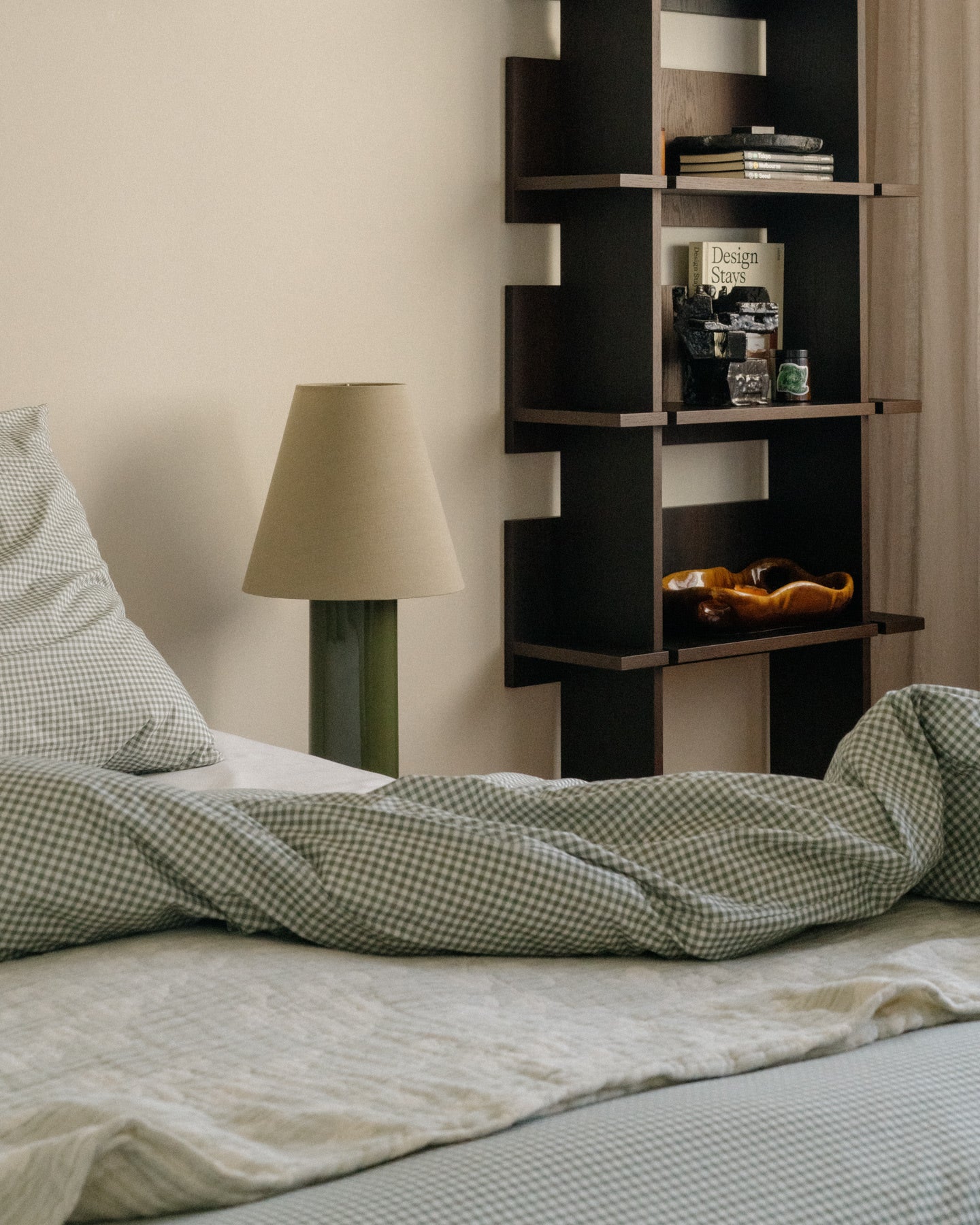 Giro" Table Lamp - Treetop & Beige — side angle on bedside table