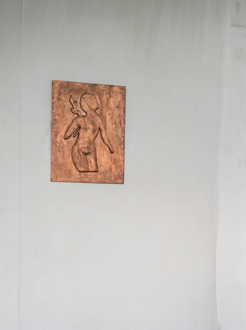 Woman with Laurel Leaves' Chikanka — wall-mounted bronze sculpture detail