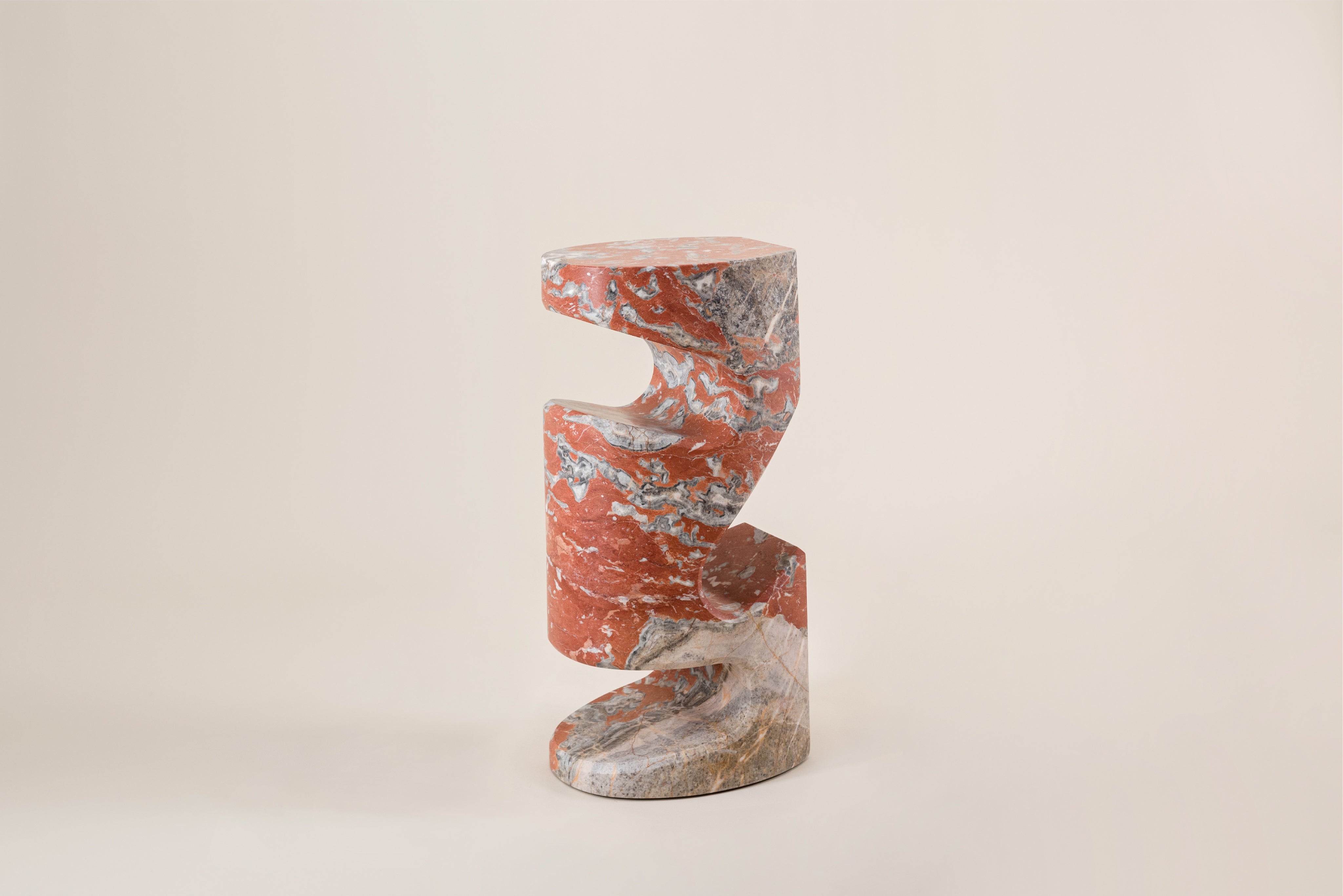 Tobo Side Table — angled view of red and gray marble design