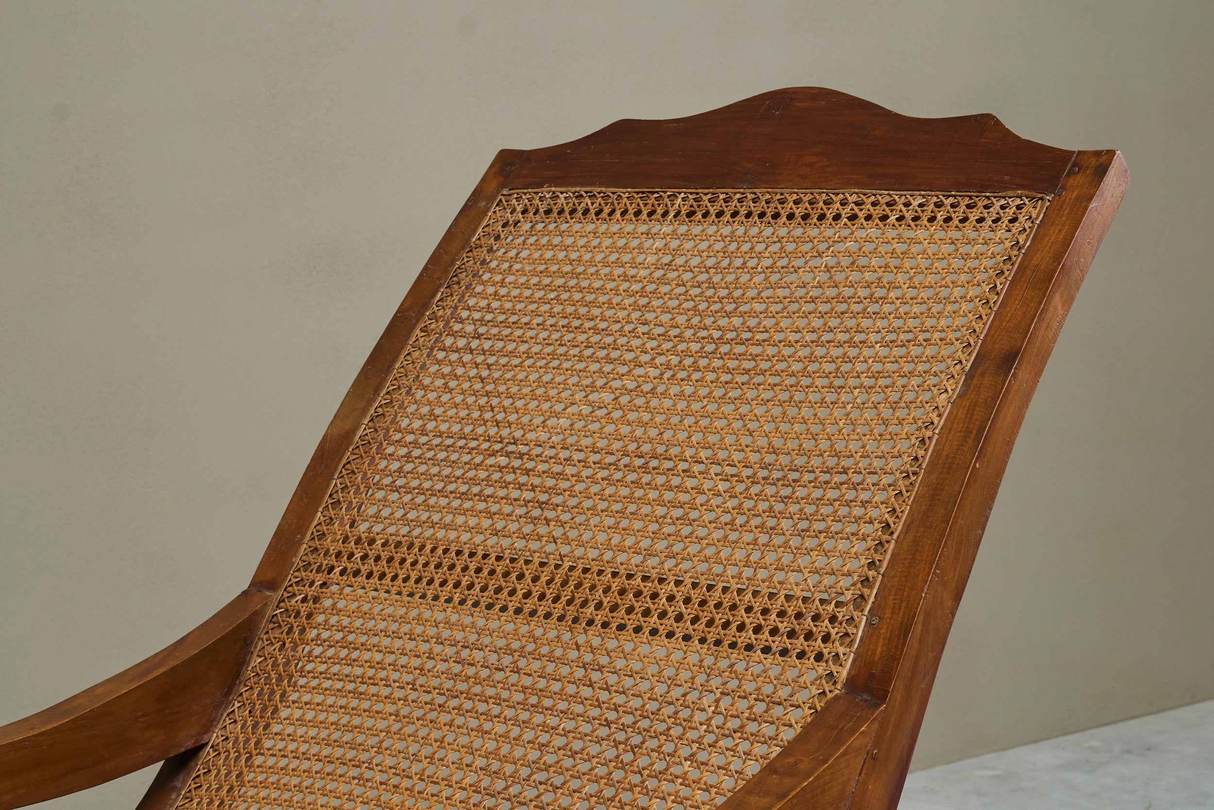 Sculptural Colonial Chaise Longue in Wood and Hand-Woven Cane, 1920s — lifestyle setting