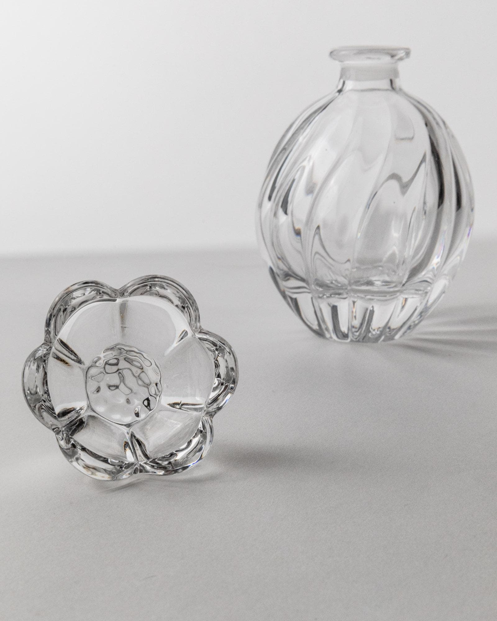 1950s Murano Glass Perfume Bottle — angled view on gray surface