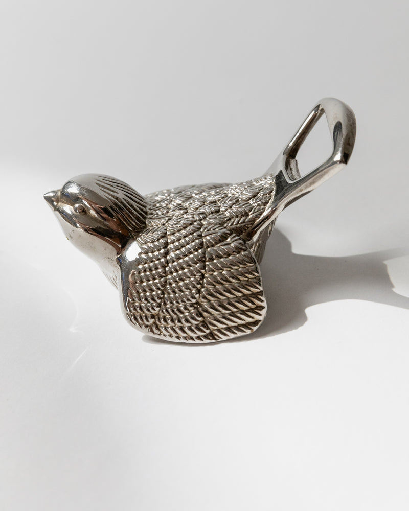 Silver plated bird bottle opener profile view showing textured wings