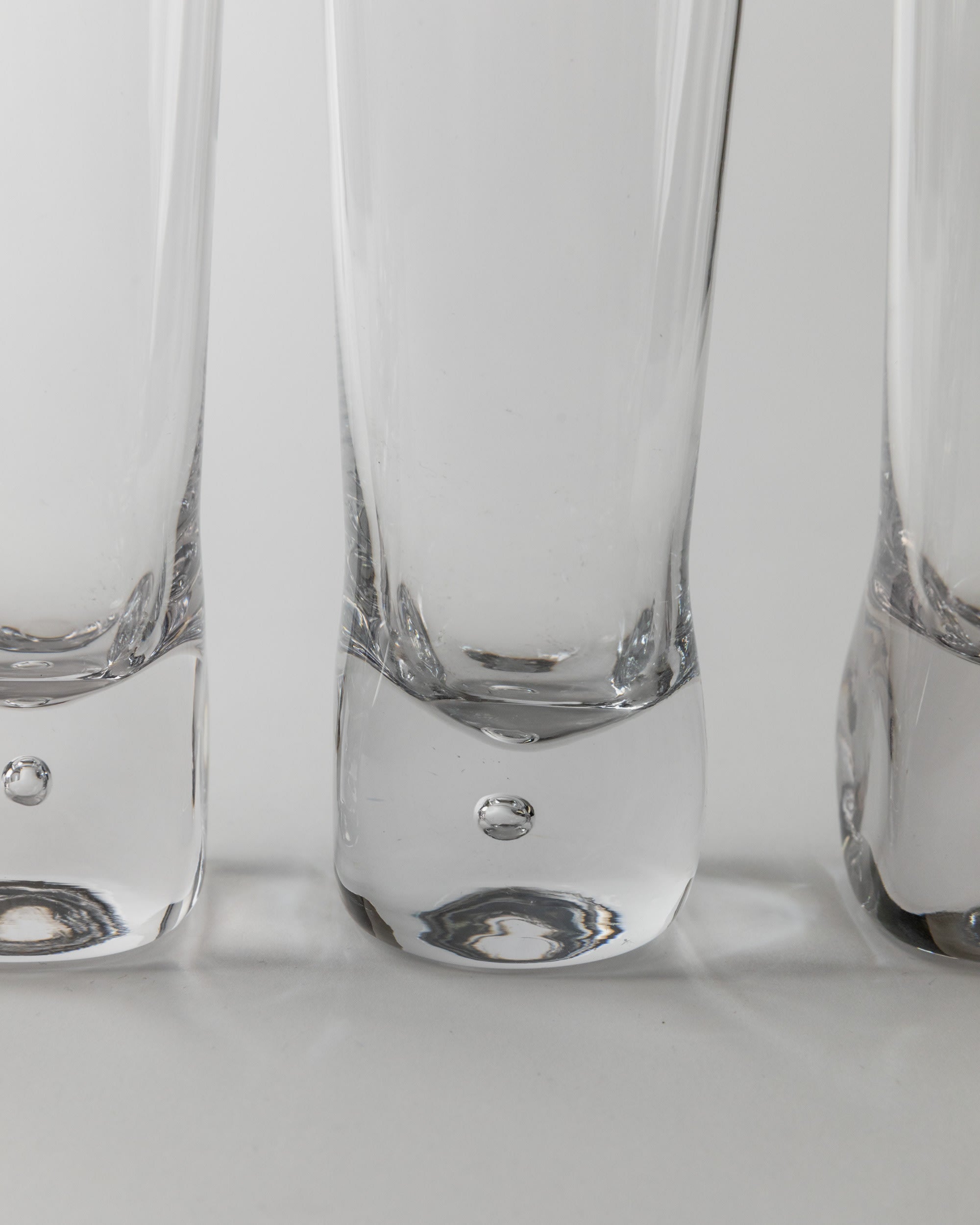 Set of 6 Vintage Murano Glasses, Italy 70s — close-up of clear glass bases