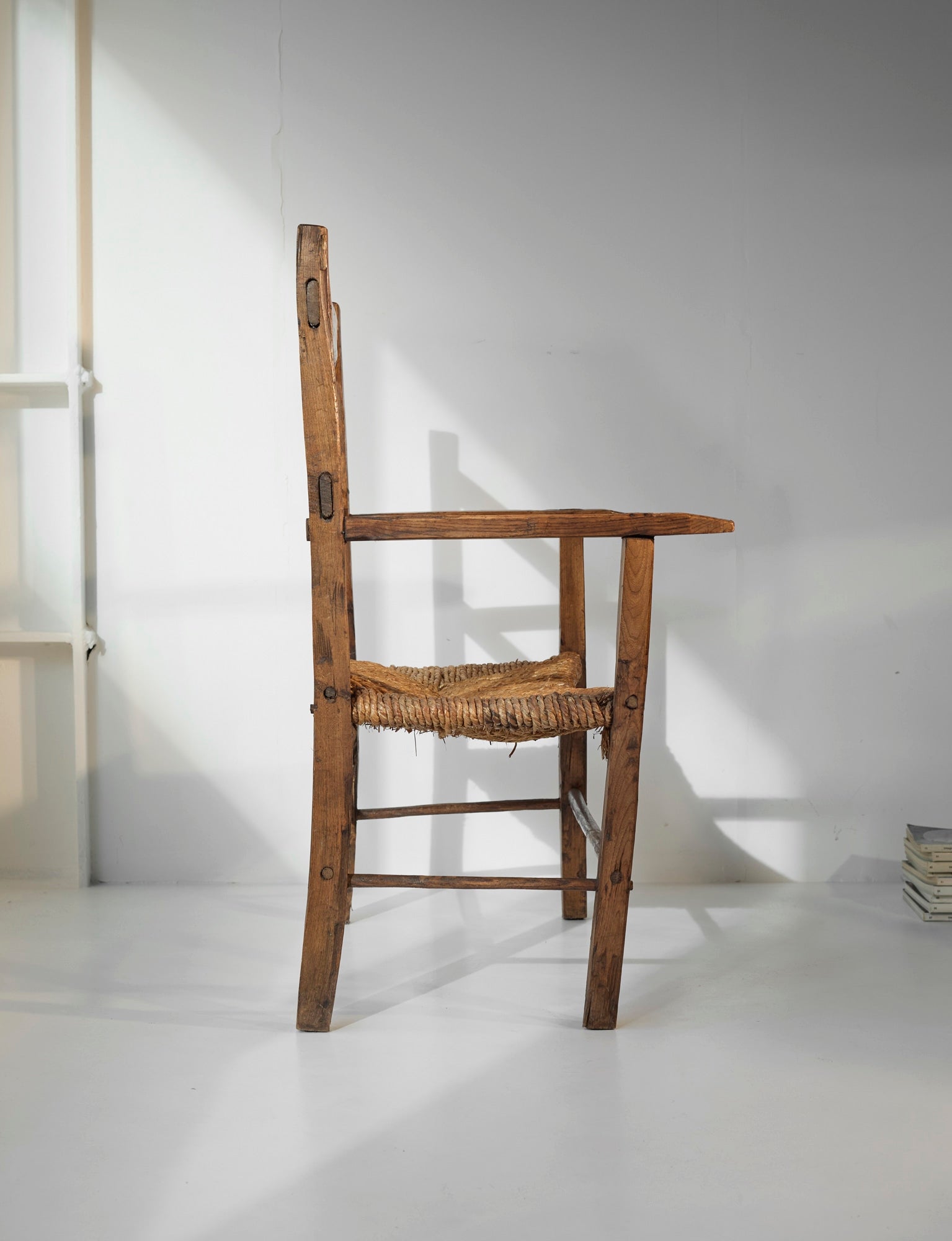 A French folk bench from the 19th Century. Wood and straw — in context