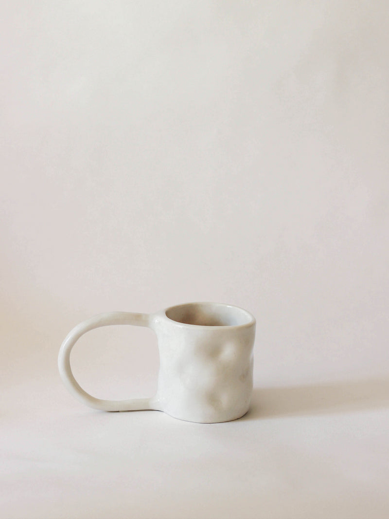 Stoneware Mugs — close-up of textured white ceramic surface