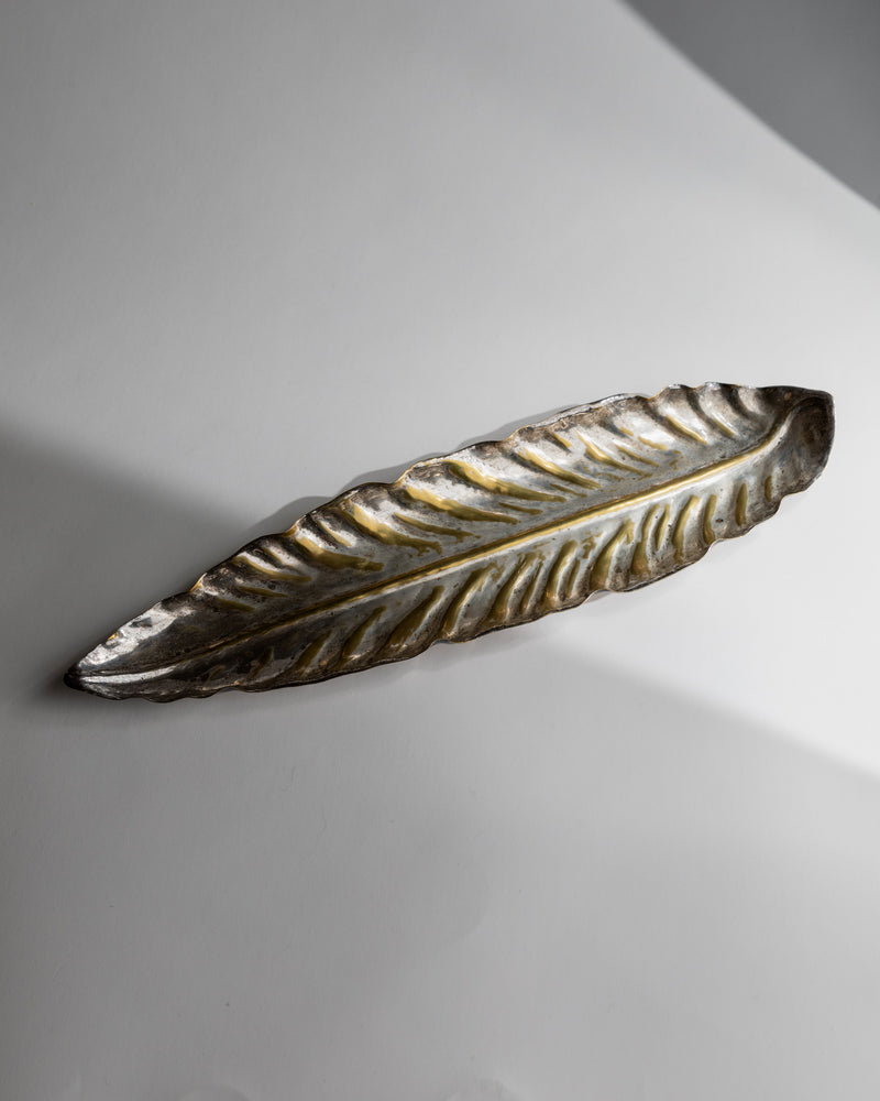 Silver plated leaf bowl showing detailed ribbed texture and patina