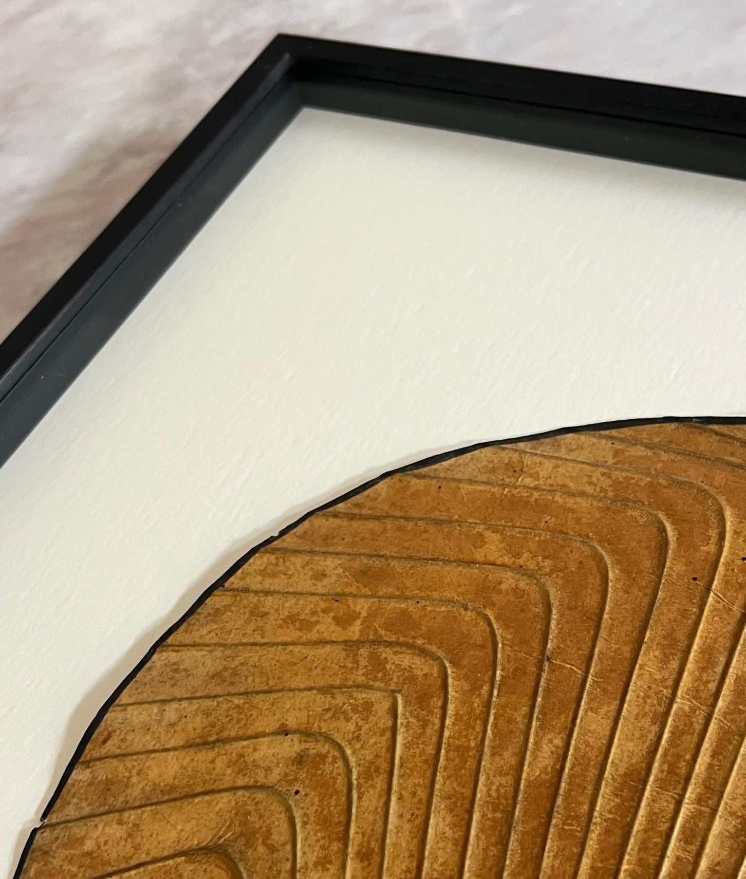 Antique Korean Fan in Frame — close-up of textured brown paper detail