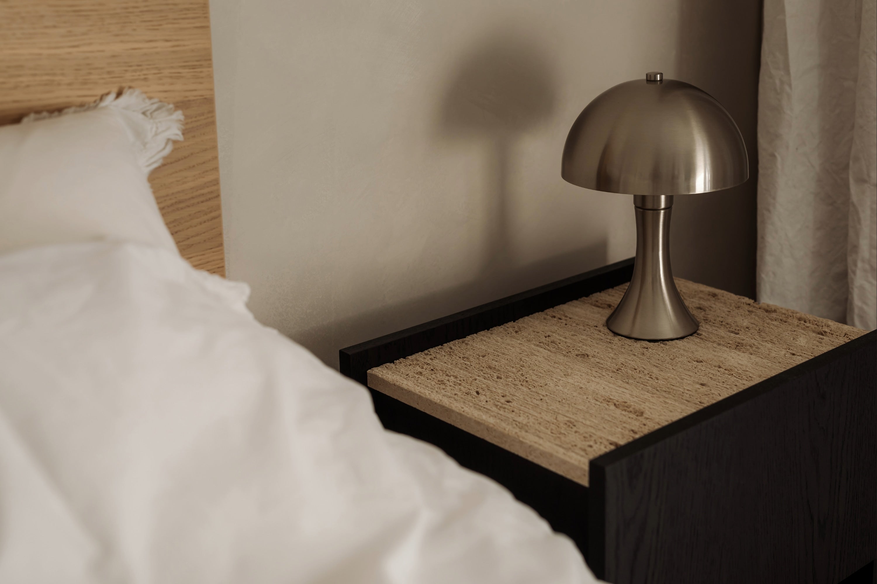 NOTO Night Stand — top view with natural stone surface and lamp