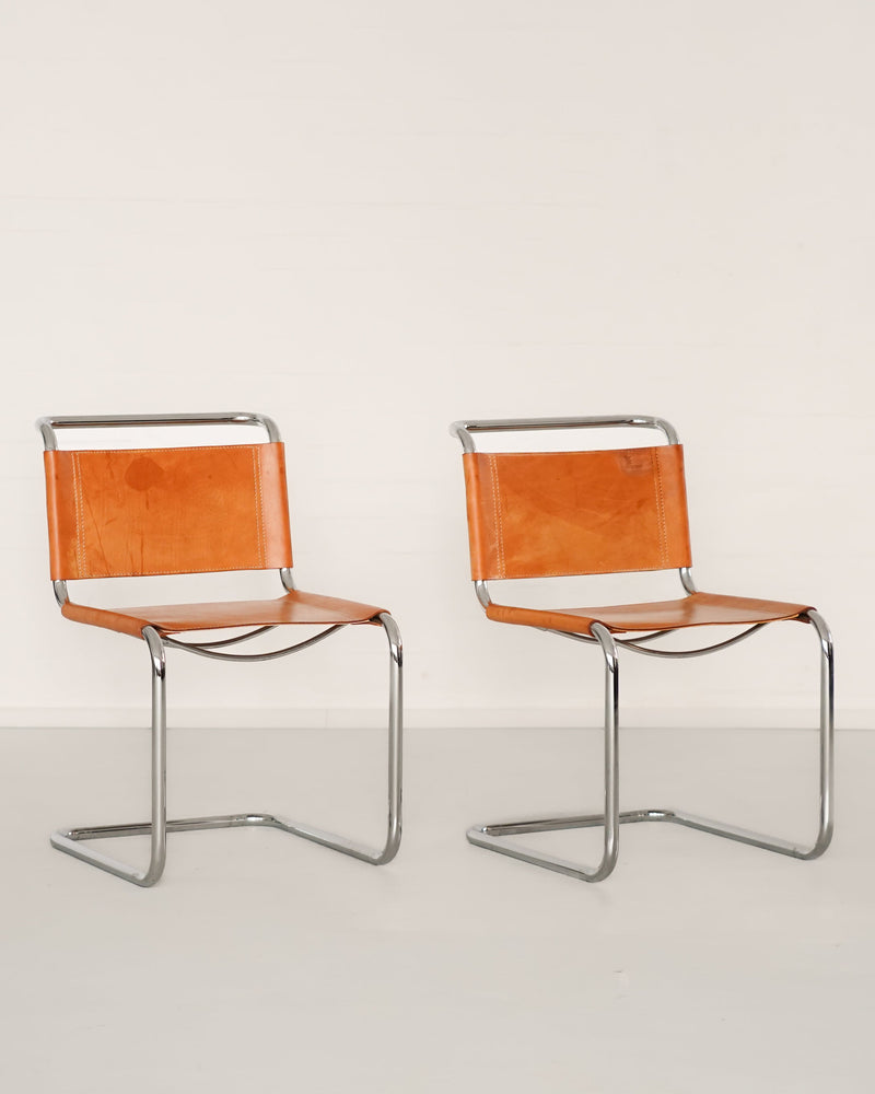 B33 cantilever chairs by Marcel Breuer with orange leather seats
