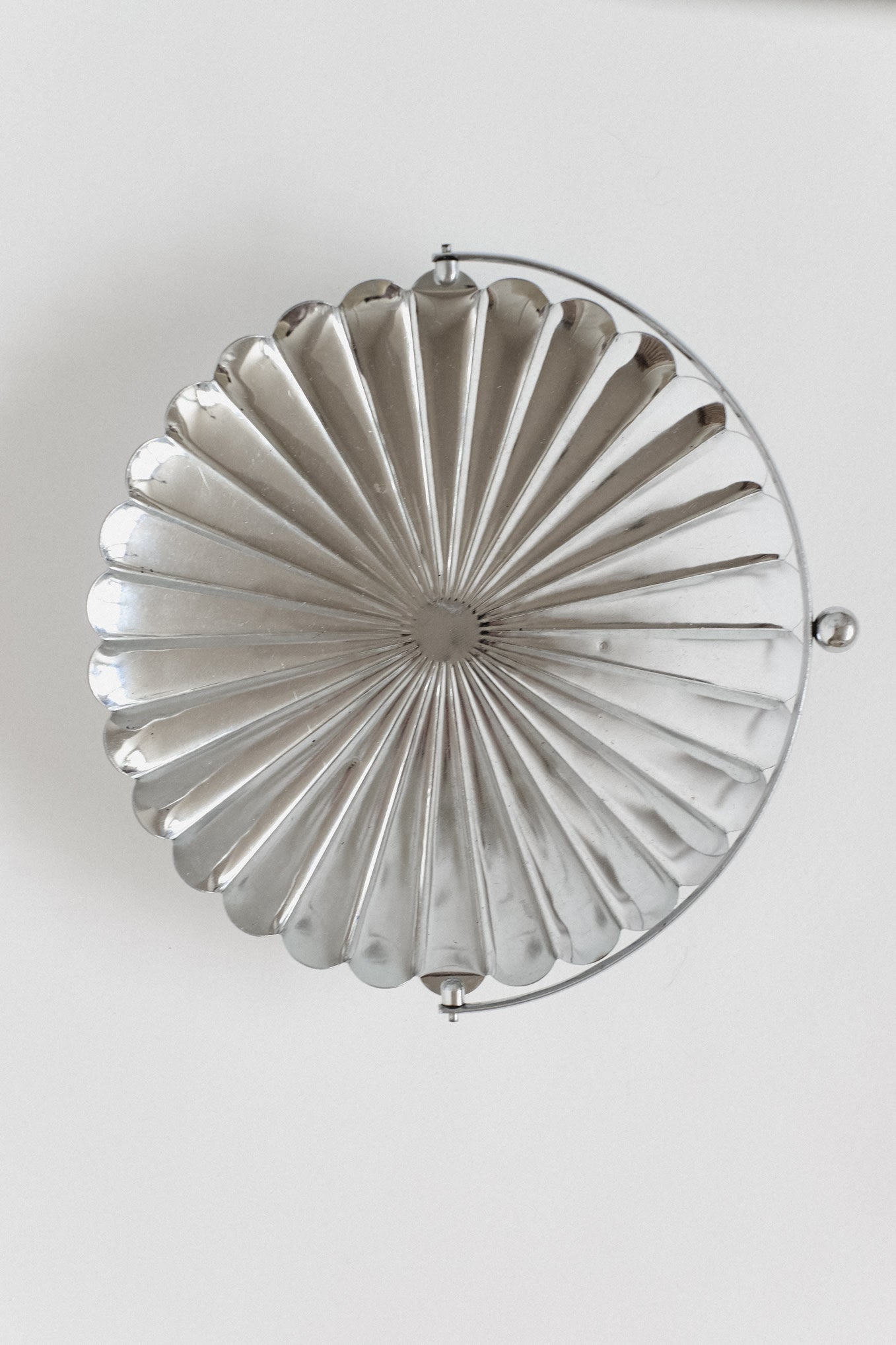 Serving Dish With Handle — top view of silver scalloped design