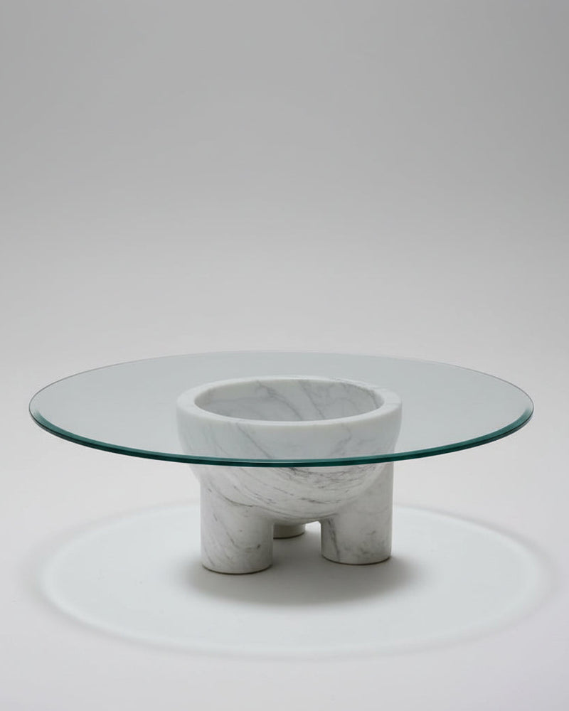 Modern glass top coffee table with sculptural white marble base