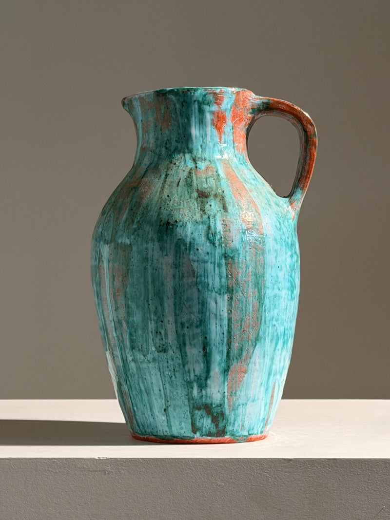 Large pitcher in green glazed earthenware, south of France, circa 1960. — detail view