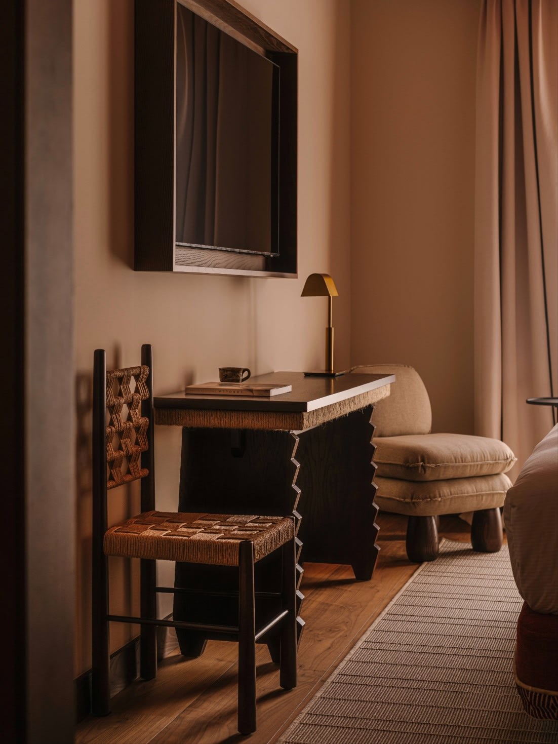 Elephant Armchair — side angle in modern bedroom setting