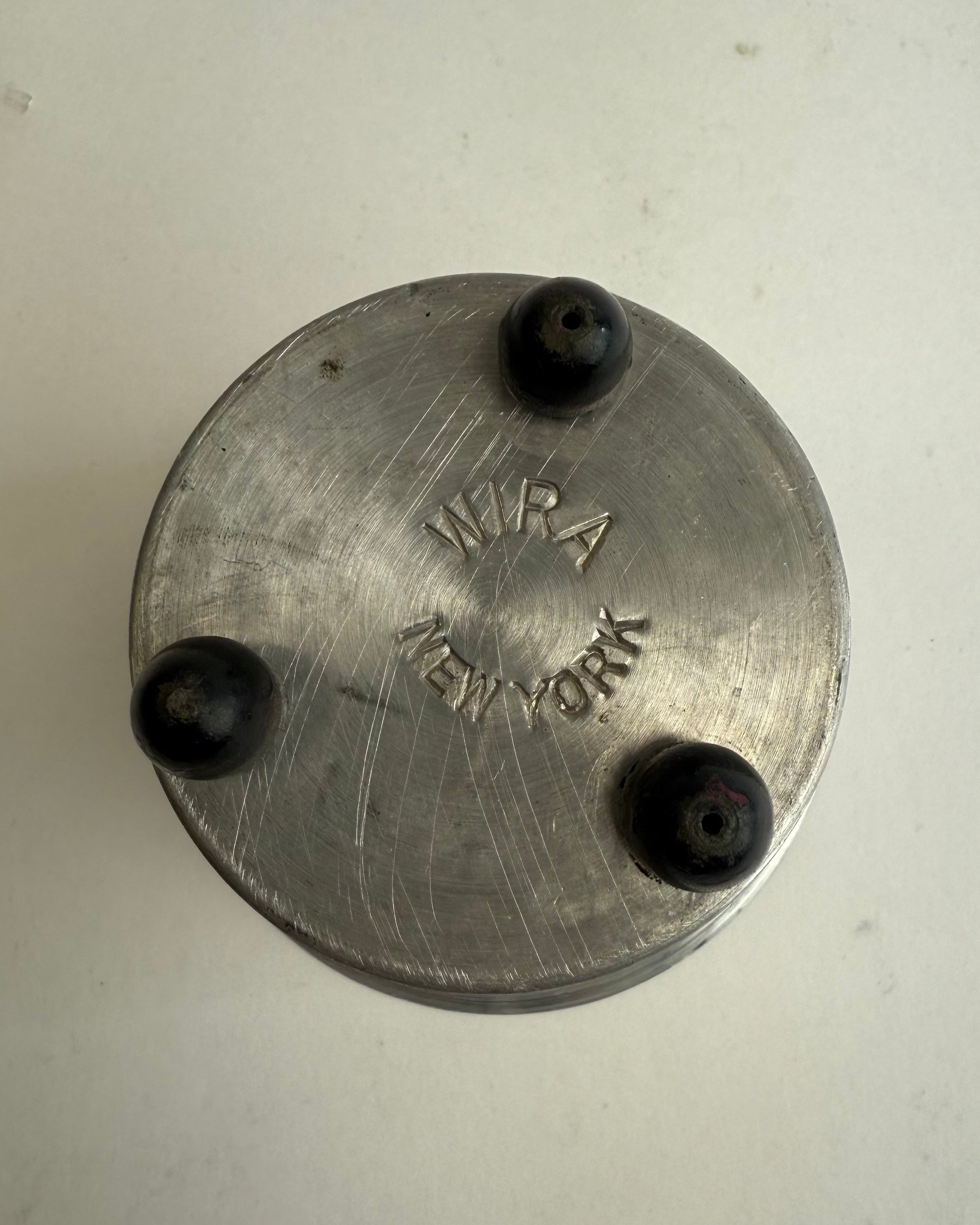 Spun Aluminum Cup by Wira NY — bottom view showing engraved logo