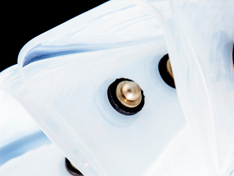 Close-up detail of opal glass trapezoid pendant light fixture
